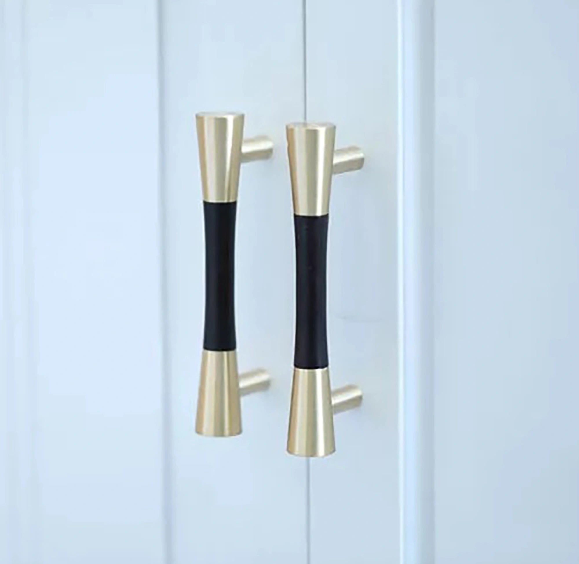 Furniture handle in brass and wood, featuring a tapered form in black and gold finish, Sylvia Handle W-0014 by Mantara.