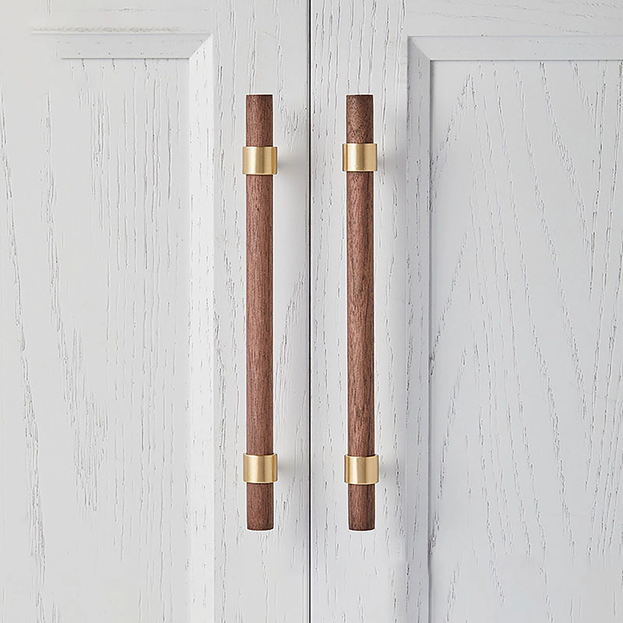Mantara Holt Handle W-0010 is a modern walnut wood & brass handle in dark brown with brushed finish, ideal for wardrobes & drawers.