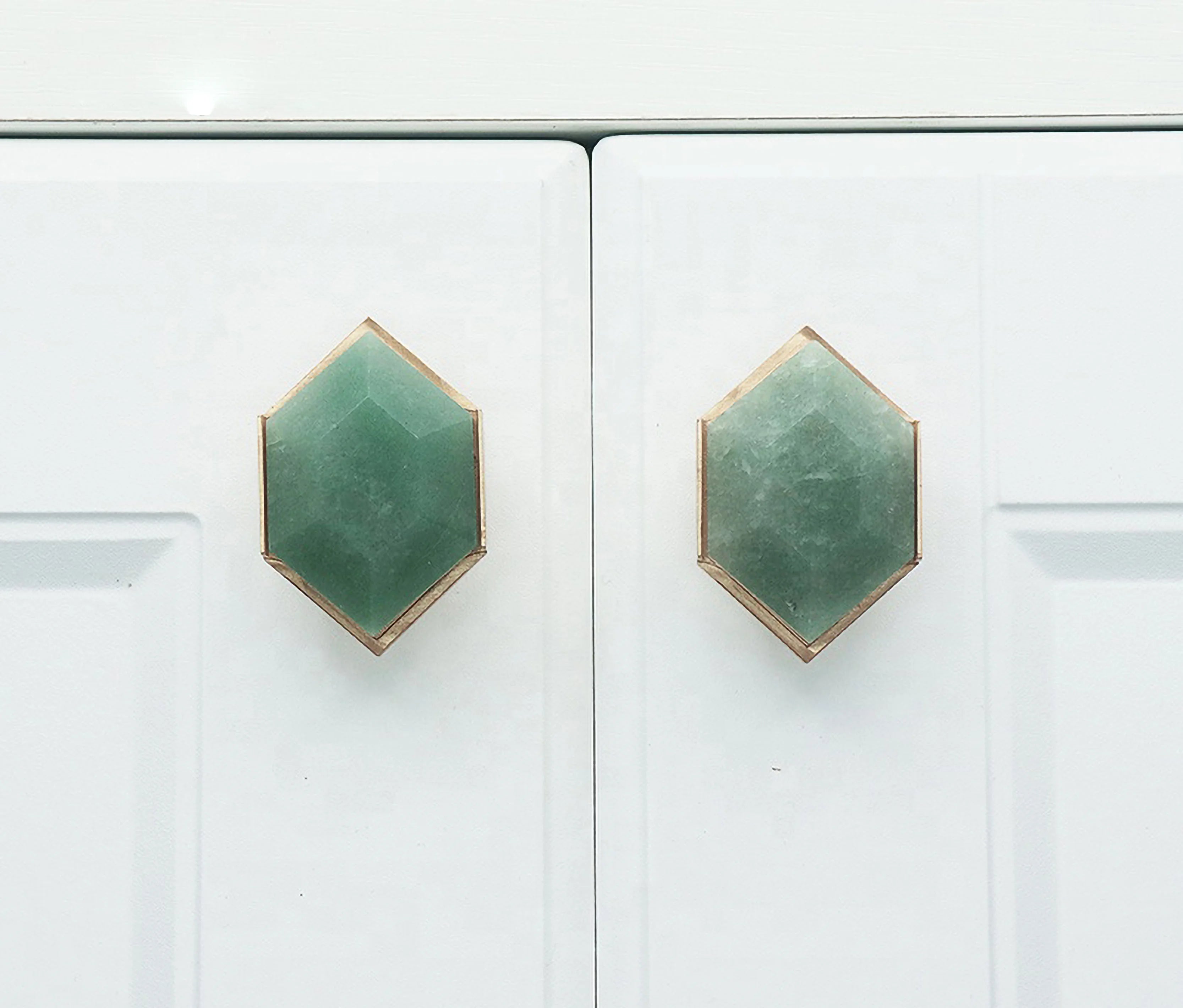 The Mantara C-0004 is a Nordic crystal + brass knob in green, ideal for wardrobes, drawers & cabinets.