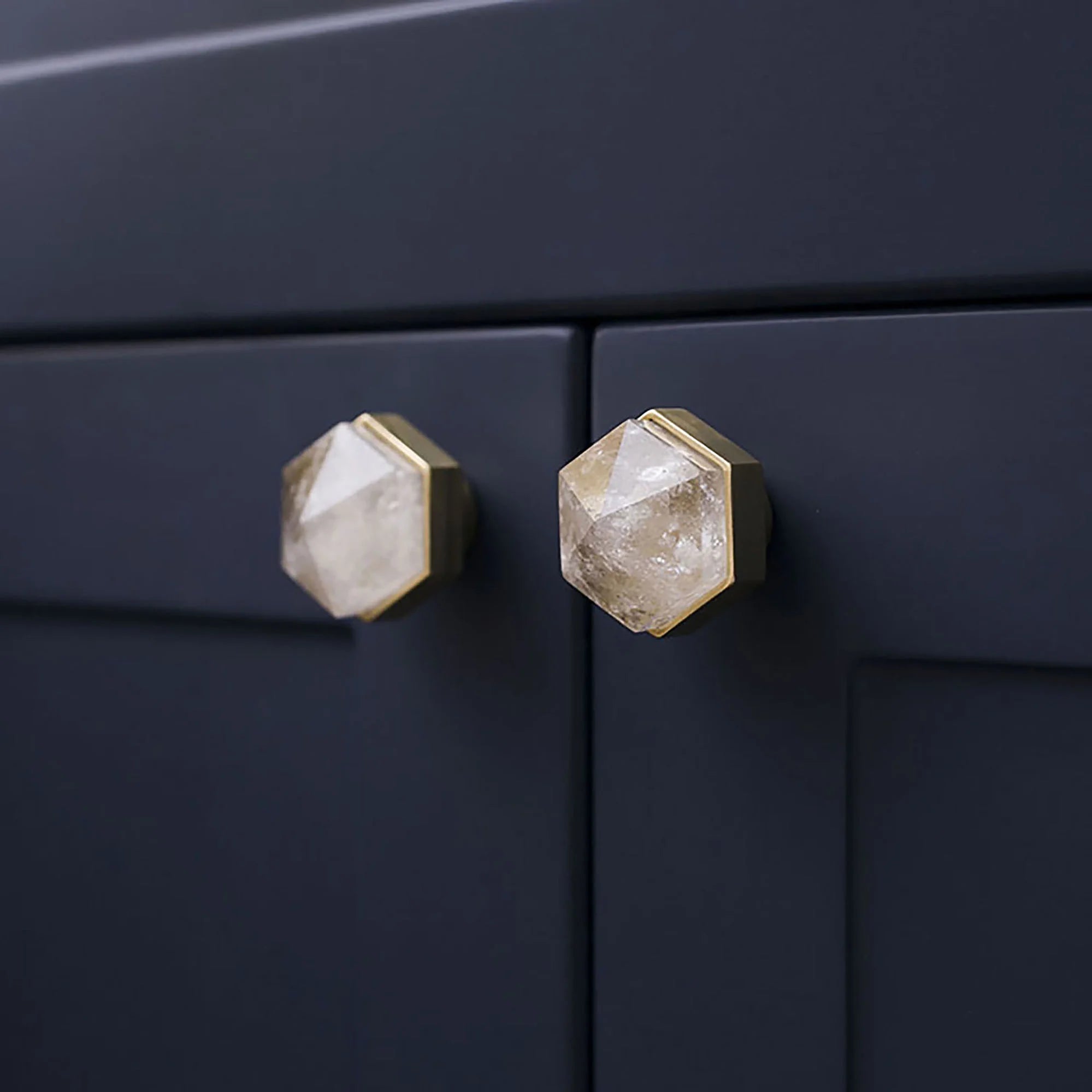 The Mantara C-0005 is a modern crystal + brass knob in white, ideal for cabinets and wardrobes.