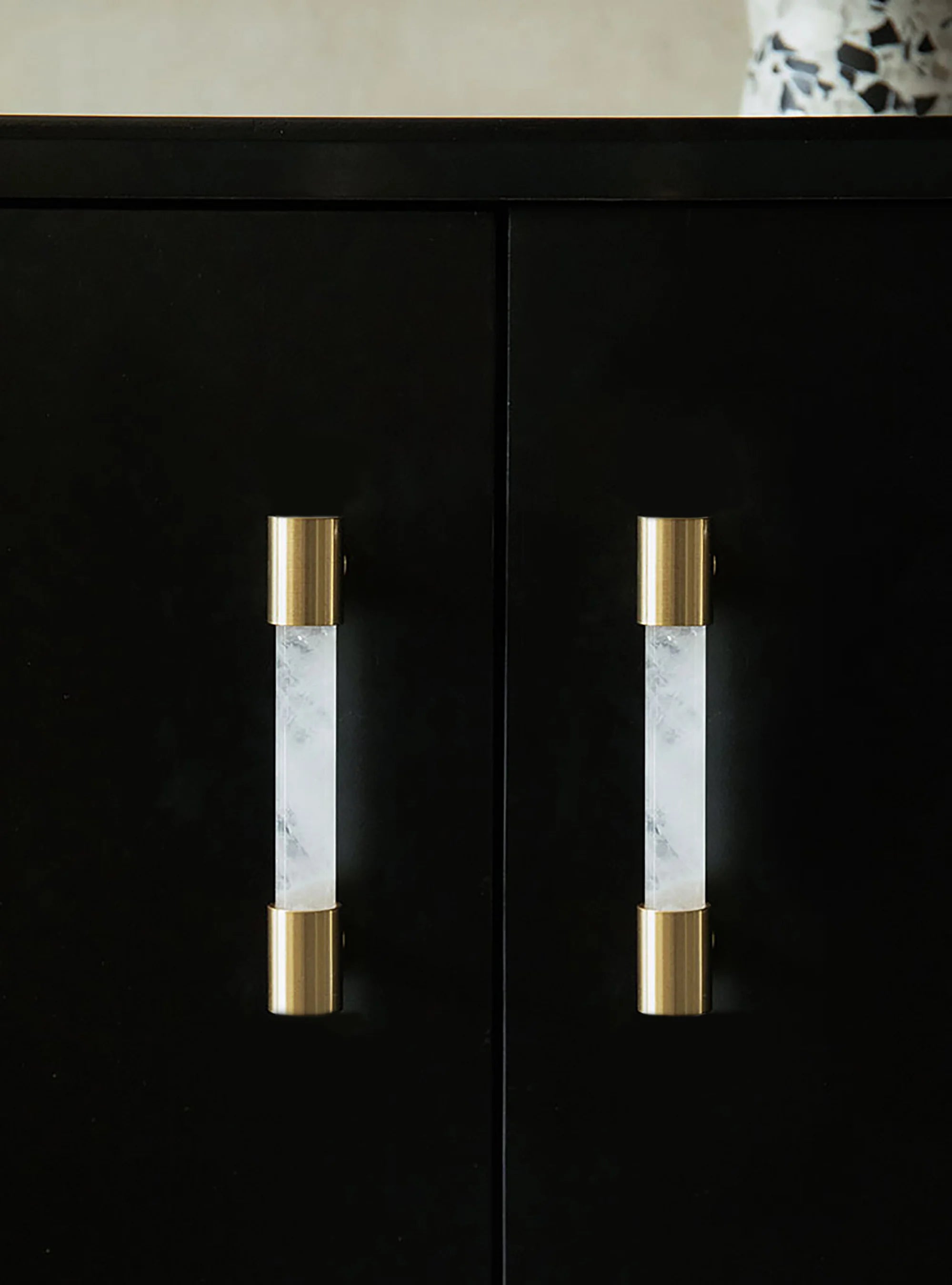 The Mantara C-0014-96 Haze Handle is a modern crystal and brass handle in white, ideal for cabinets and wardrobes.