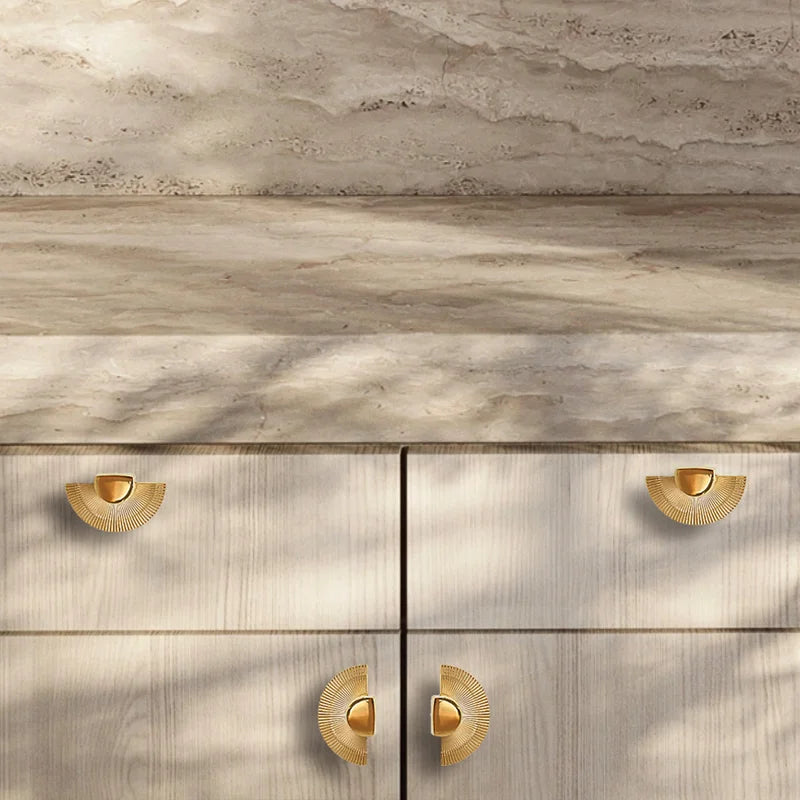 Mantara Palm Knob B-0085 is a modern polished brass knob in gold, perfect for doors, cabinets, and wardrobes.