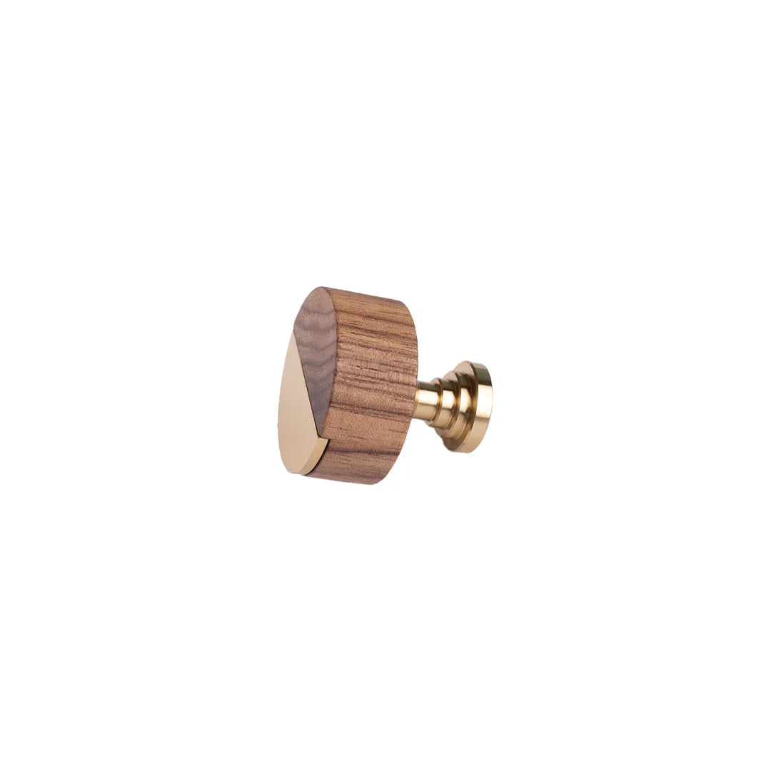 A modern cabinet knob featuring a geometric triangular wooden head with a dark brown wood grain pattern and a polished brass post, shown on a plain white background.