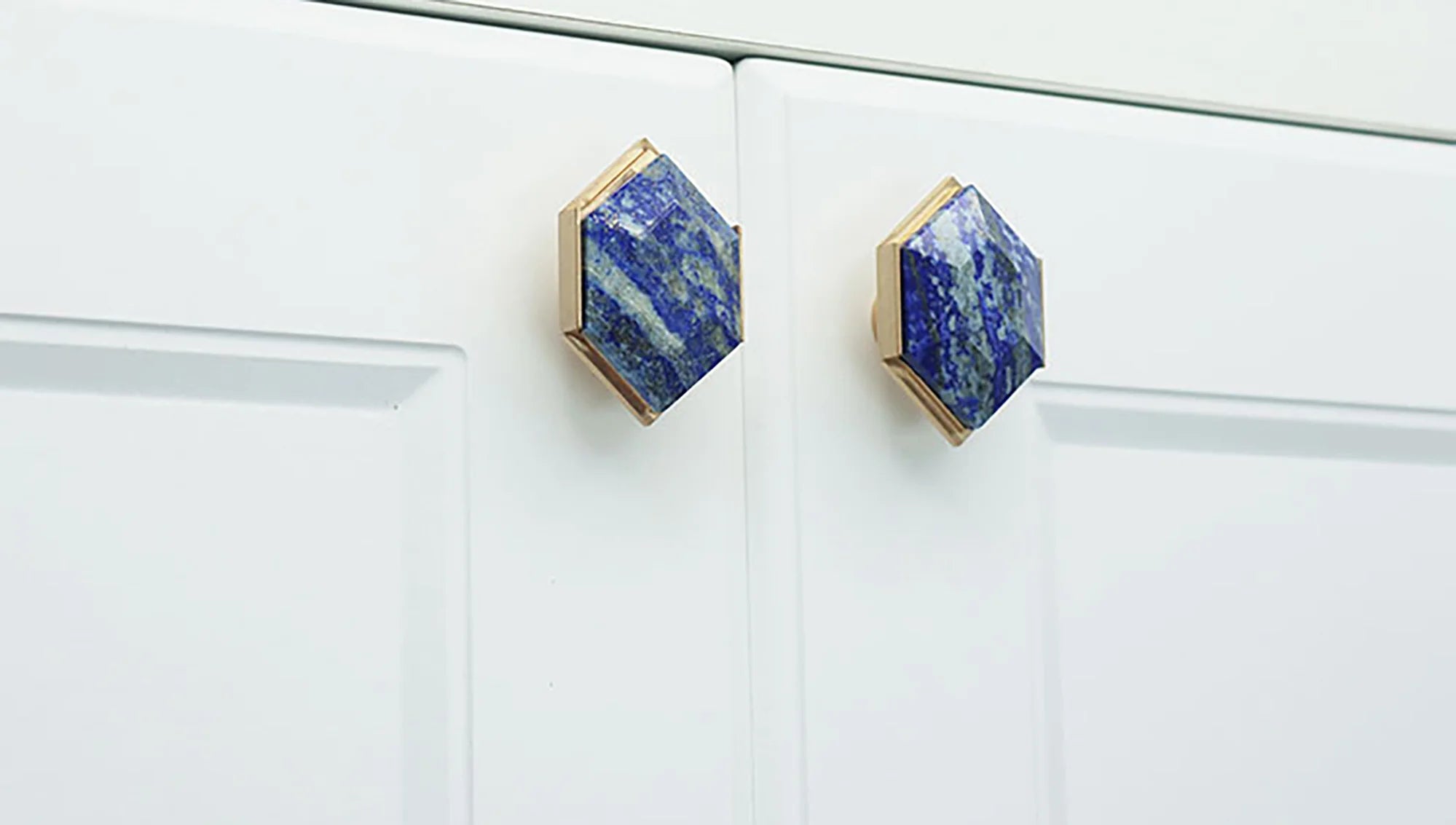 The Mantara C-0004 is a Nordic crystal + brass knob in blue, ideal for wardrobes, drawers & cabinets.