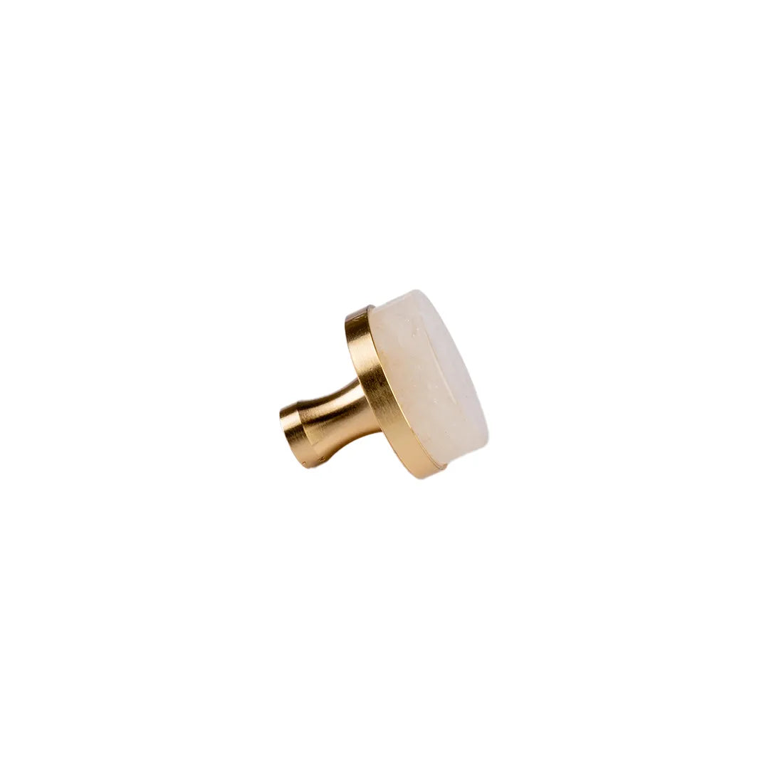 Brass gold with white crystal round knob faced side angle on white background