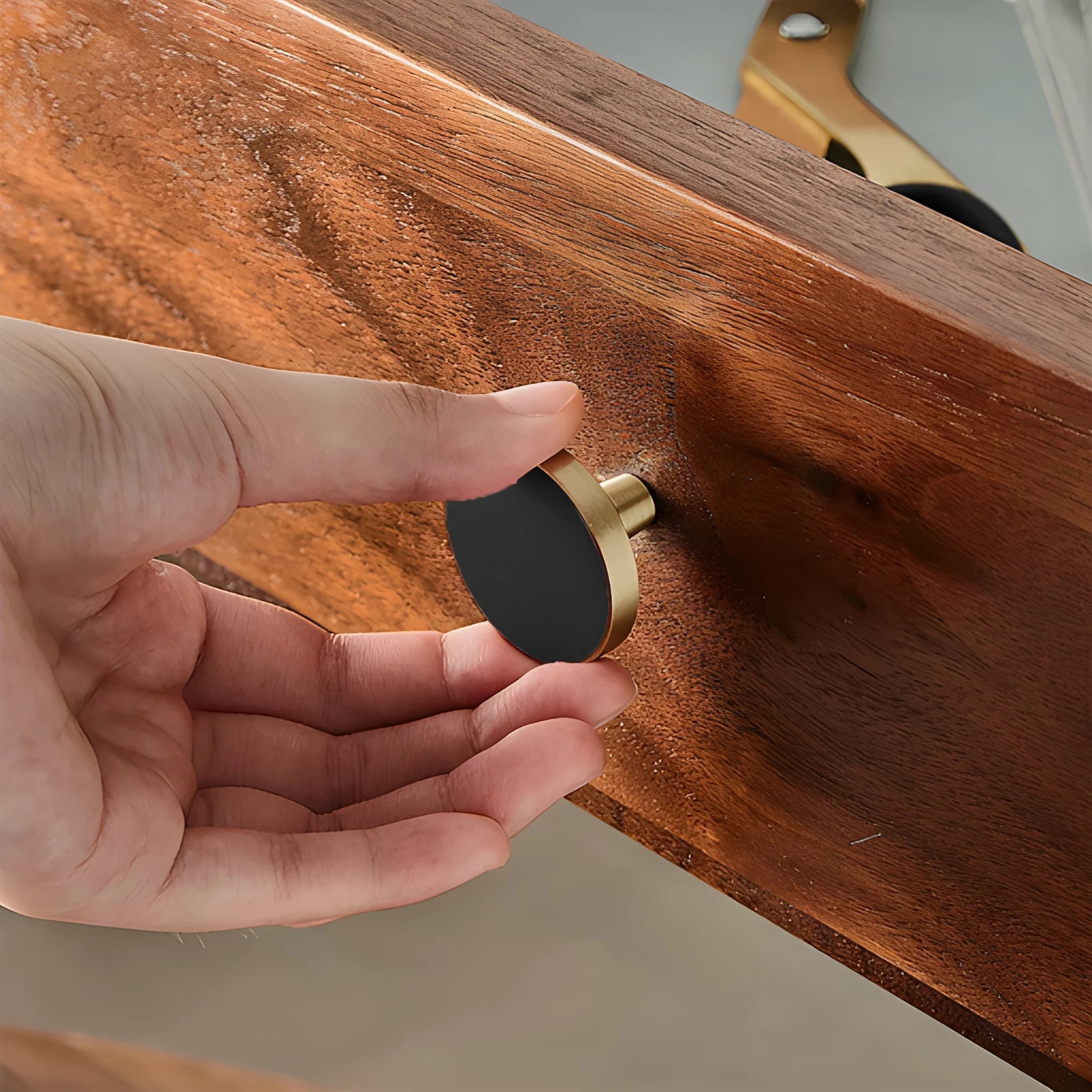 The Mantara L-0004 Obsidian Knob is a modern brass and leather knob in black, perfect for wardrobes, kitchens, and cabinets.