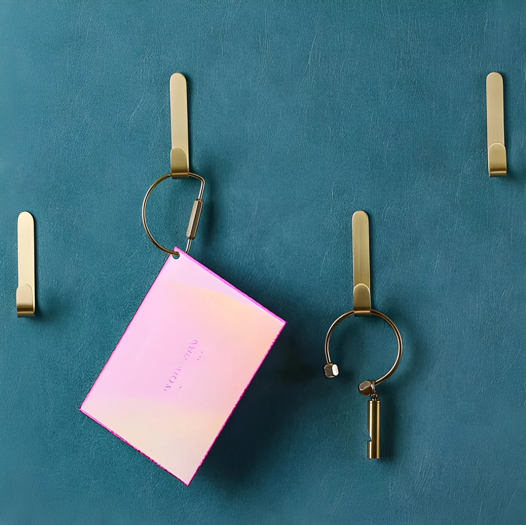 Mantara Aria Hook B-0090 is a modern brushed brass wall hook in gold, ideal for bedrooms, bathrooms, and living spaces.