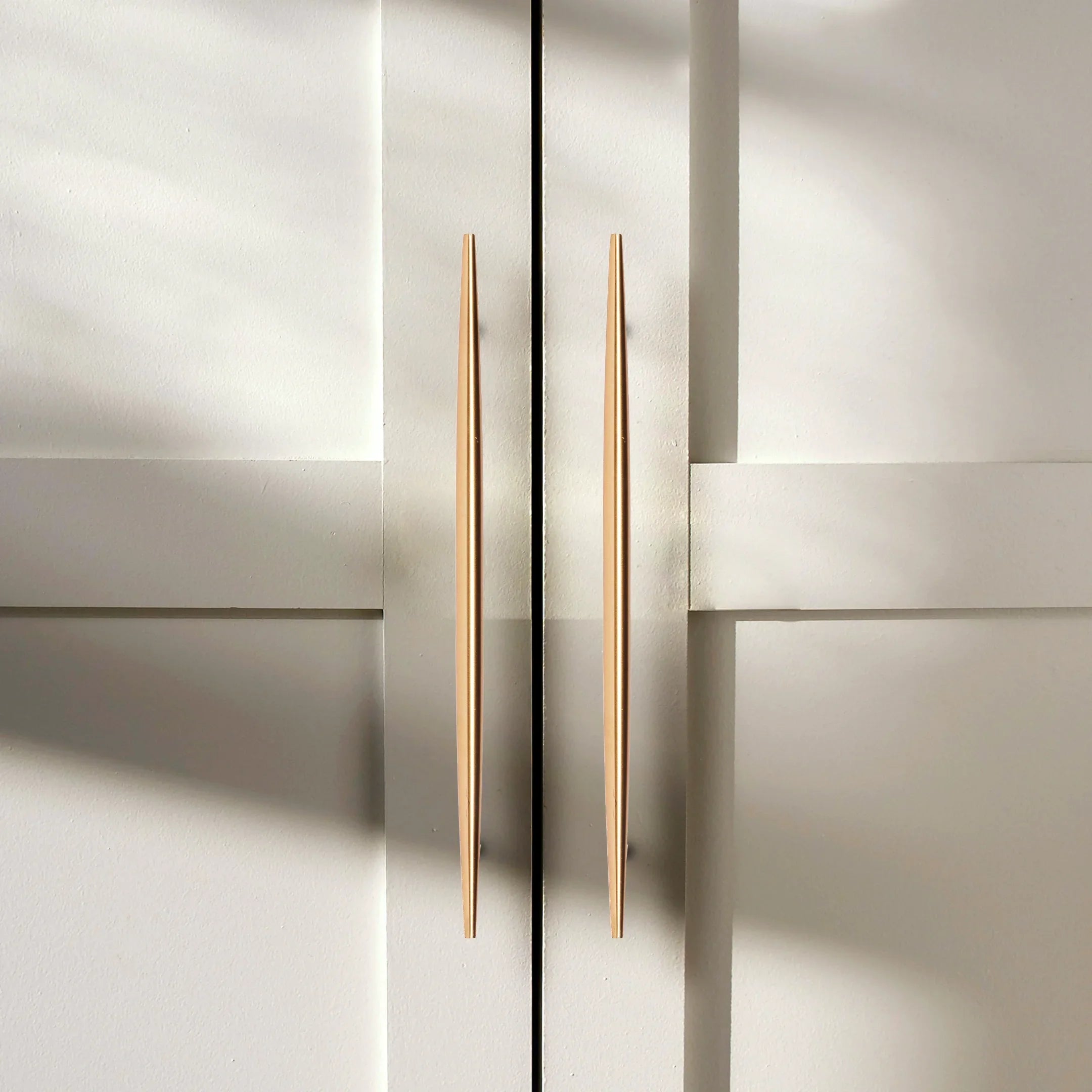 Mantara Gilded T Bar Handle B-0072 is a modern brass handle in brushed gold, ideal for wardrobes, doors, and kitchens.