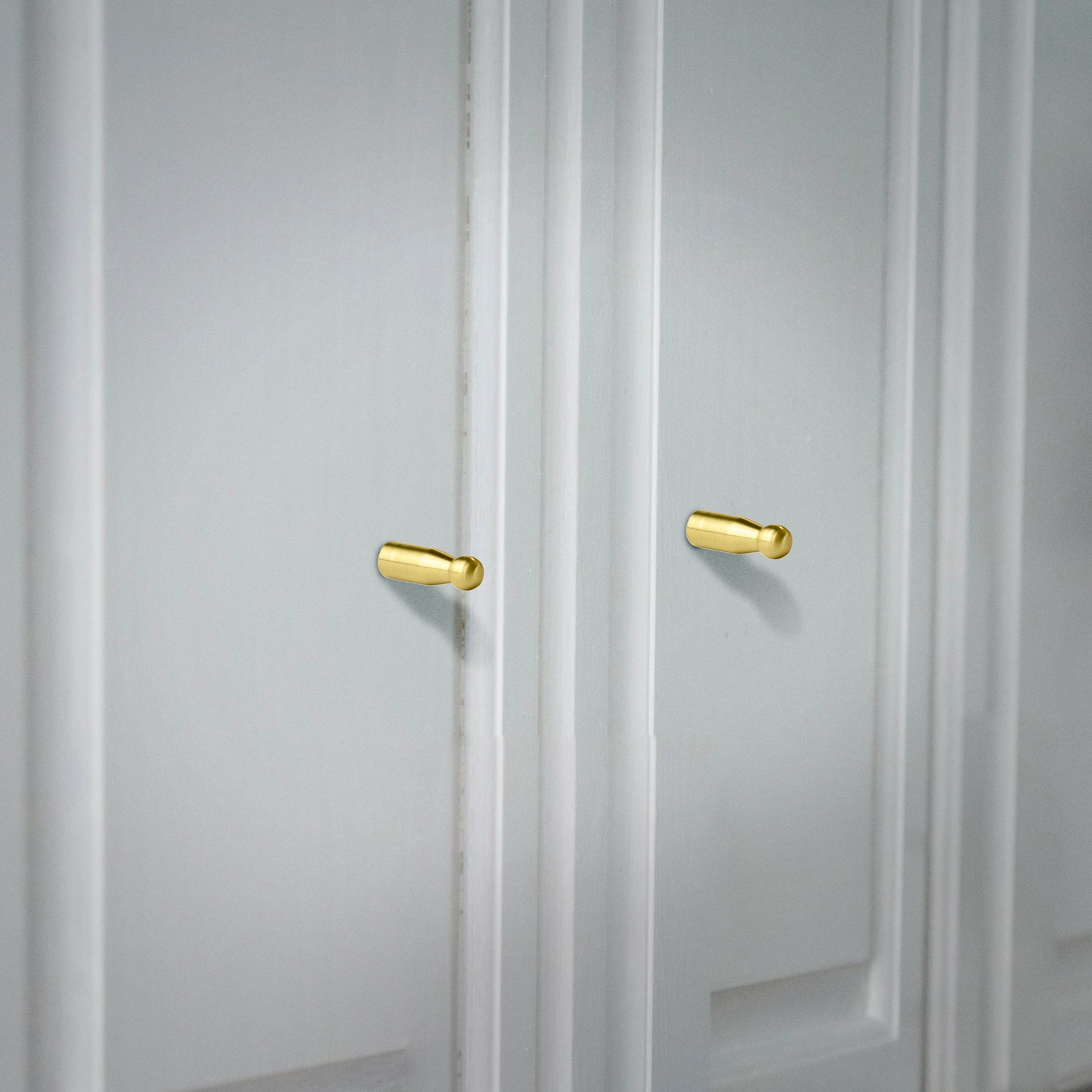 Mantara Aster Hook B-0093 is a modern brushed brass wall hook in gold, ideal for bathrooms, bedrooms, and living spaces.