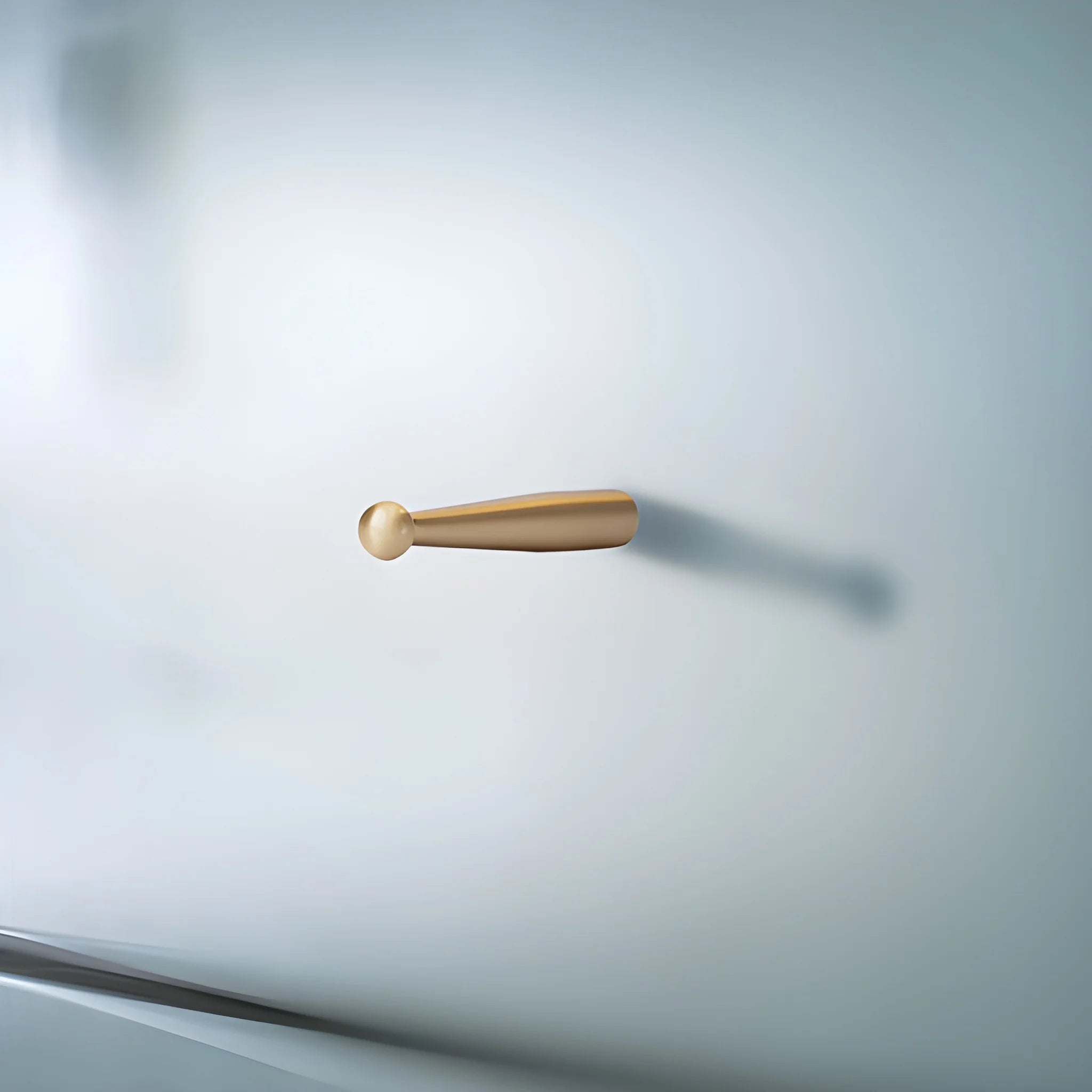 Mantara Mateo Hook B-0095 is a modern brushed brass wall hook in gold, ideal for bathrooms, bedrooms, hotels, and living rooms.