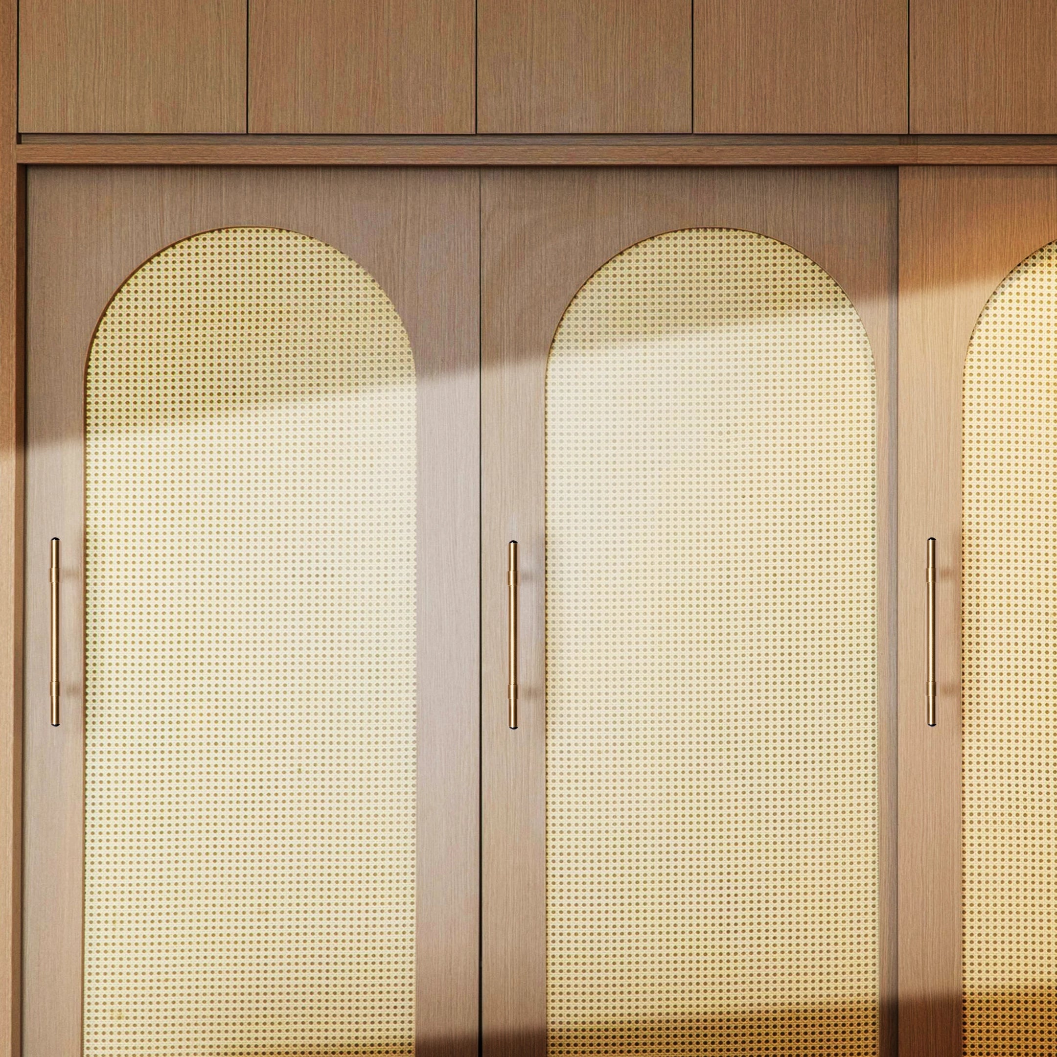 The Zania Handle by Mantara B-0111 is a modern brushed brass handle in gold, ideal for kitchens, dressers, and cabinets.
