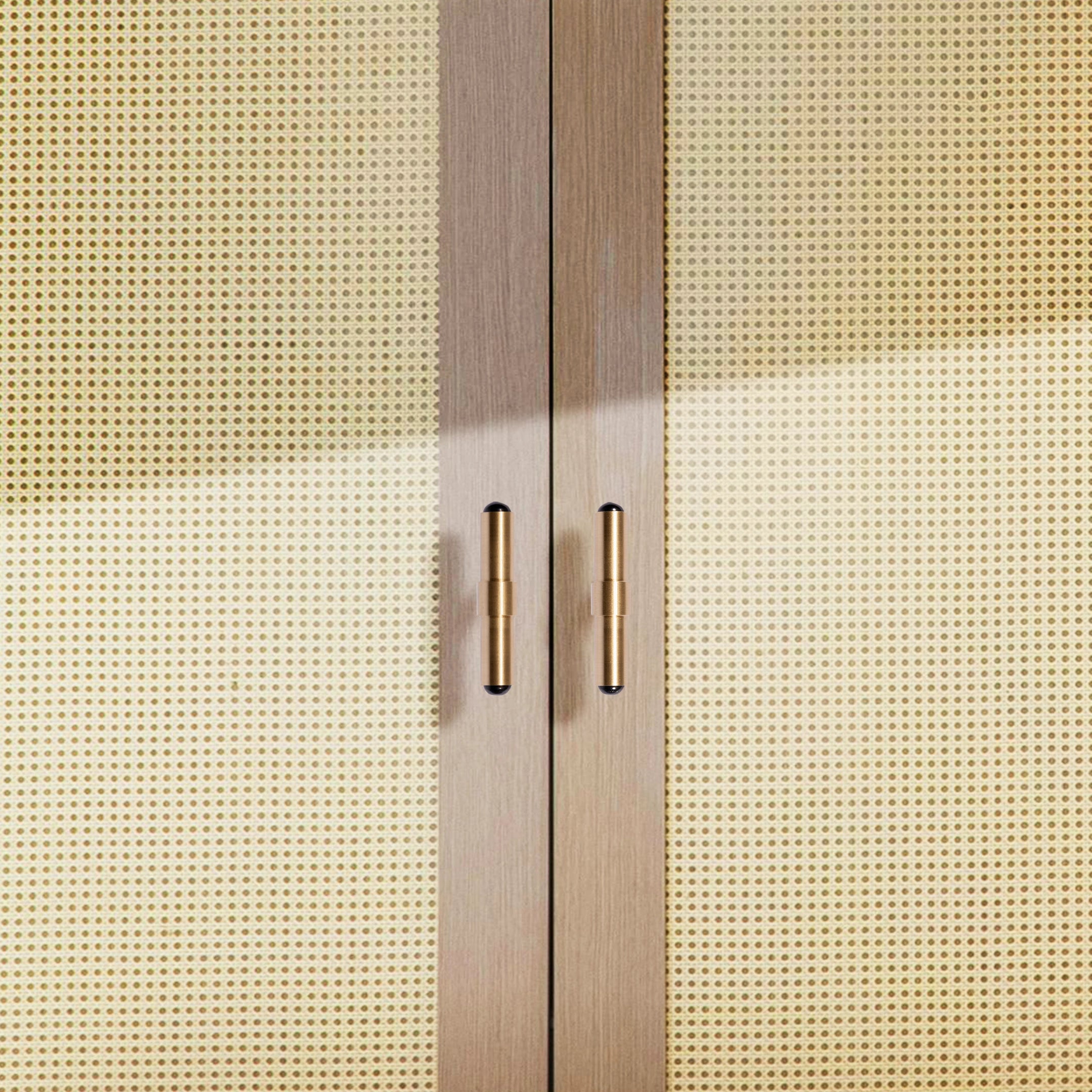 The Zania Handle by Mantara B-0111 is a modern brushed brass handle in gold, ideal for kitchens, dressers, and cabinets.