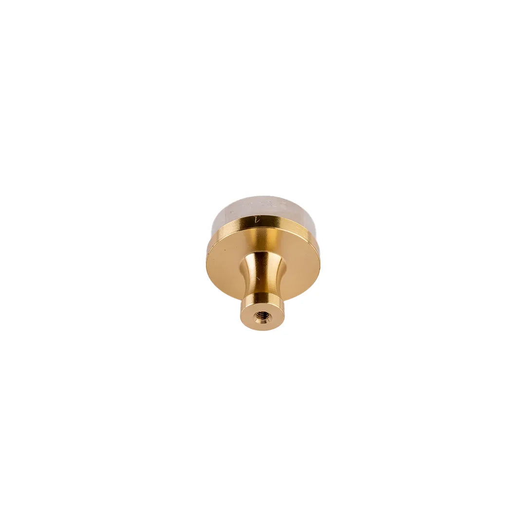 Brass with crystal white round knob placed backside of the product and shown on the white background