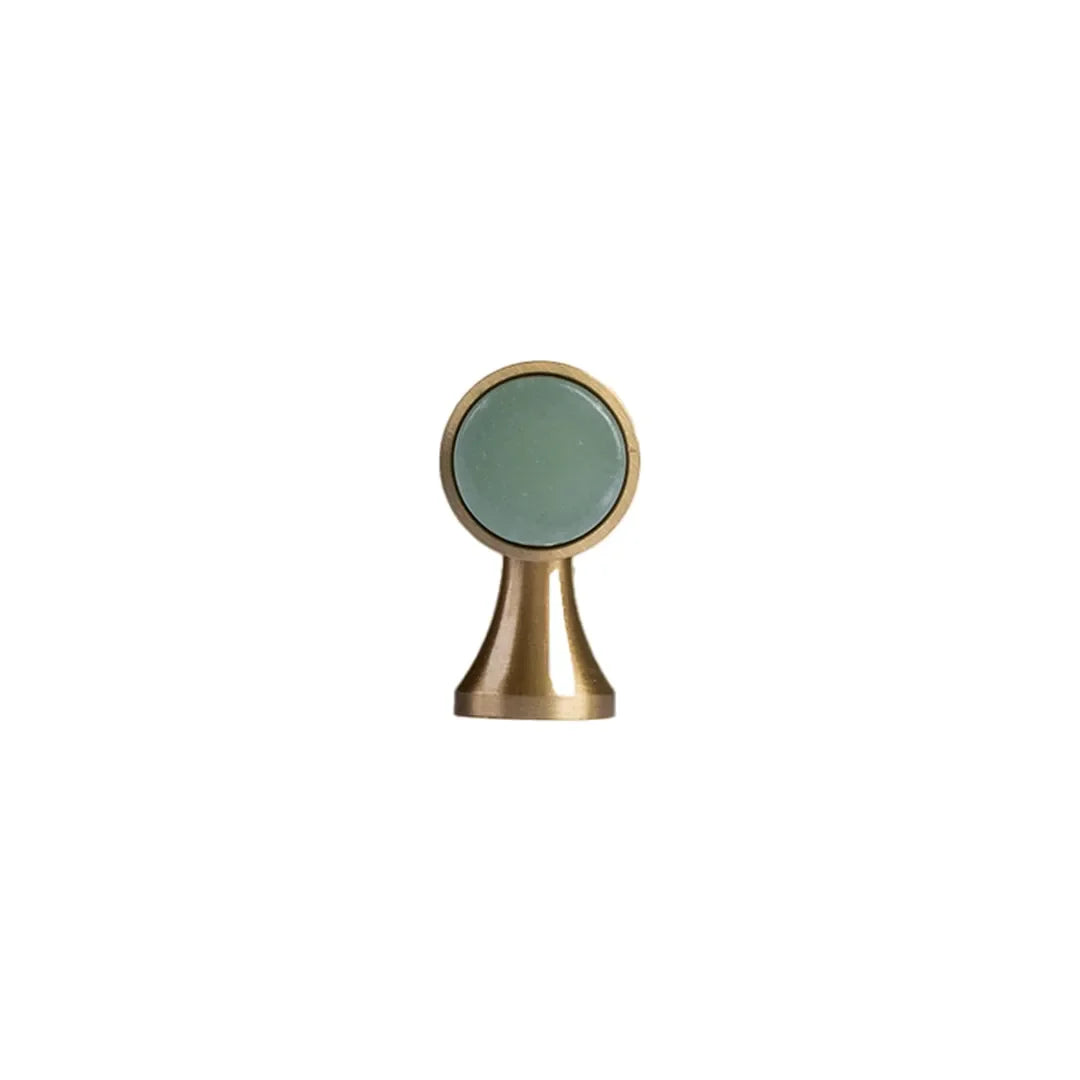 The Mantara C-0014-T Haze Handle is a modern crystal and brass T-handle in green, ideal for wardrobes and drawers.