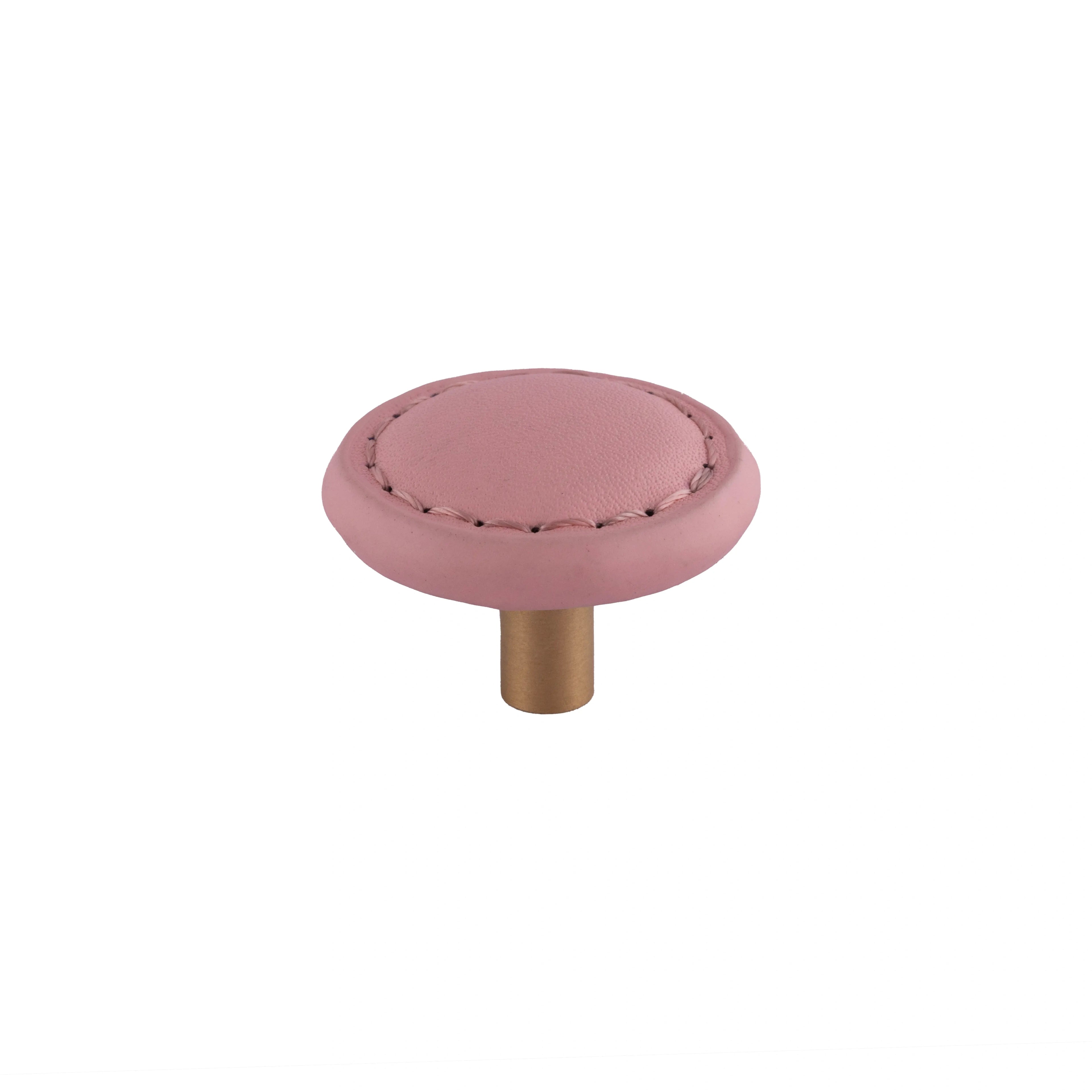 The Mantara L-0008 Sofia Round Knob is a modern leather knob in pink, ideal for cabinets and wardrobes.