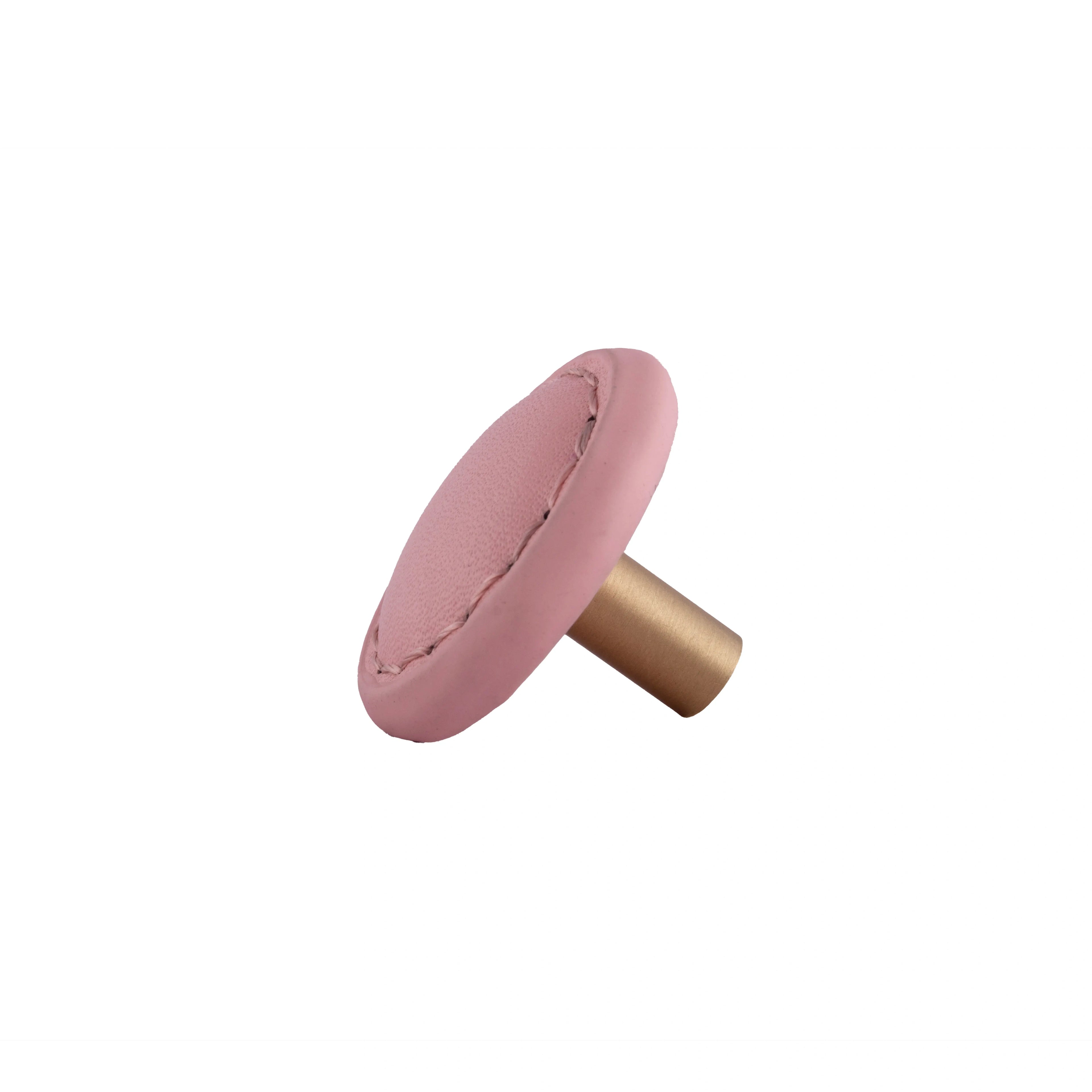 The Mantara L-0008 Sofia Round Knob is a modern leather knob in pink, ideal for cabinets and wardrobes.