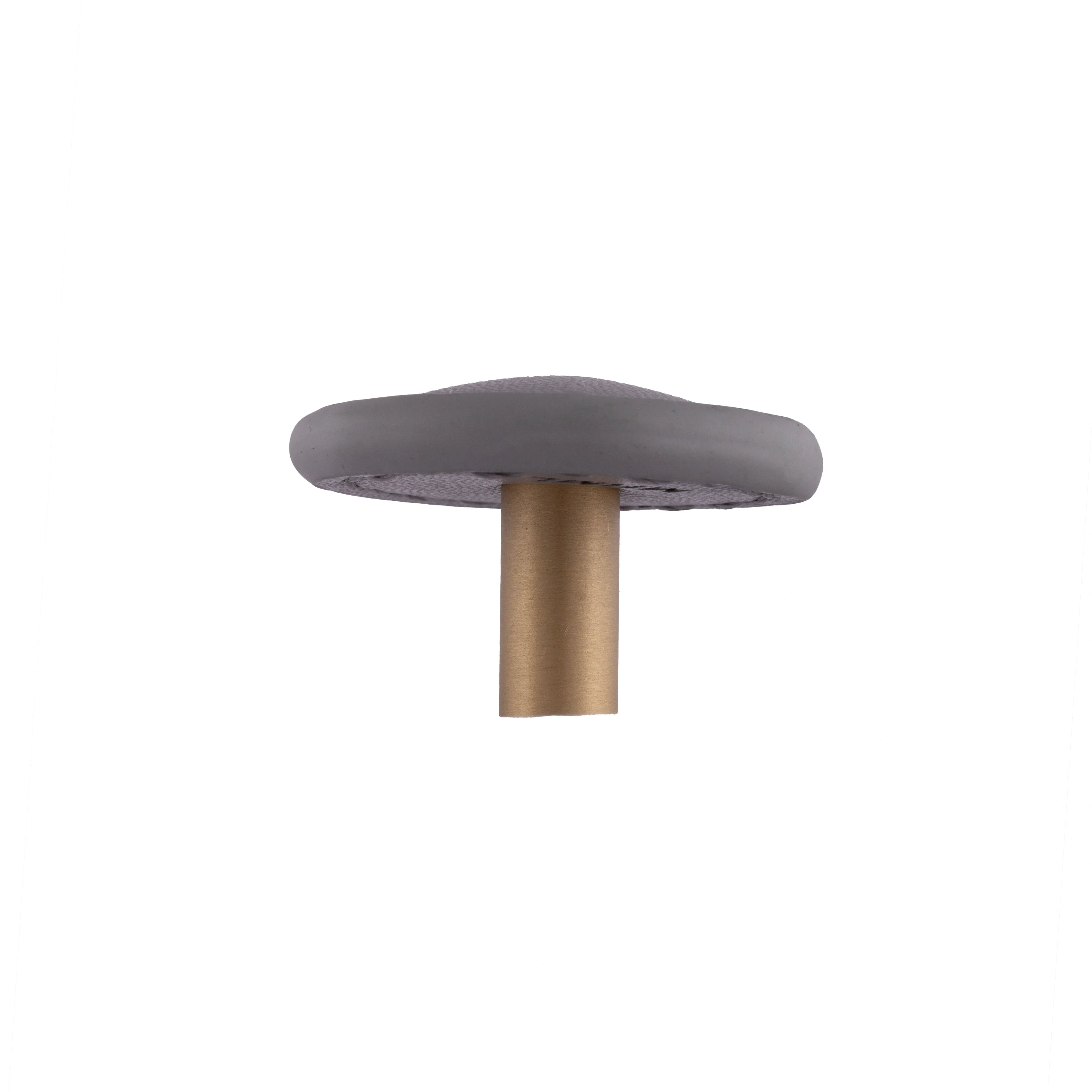 The Mantara L-0008 Sofia Round Knob is a modern leather knob in grey, ideal for cabinets and wardrobes.