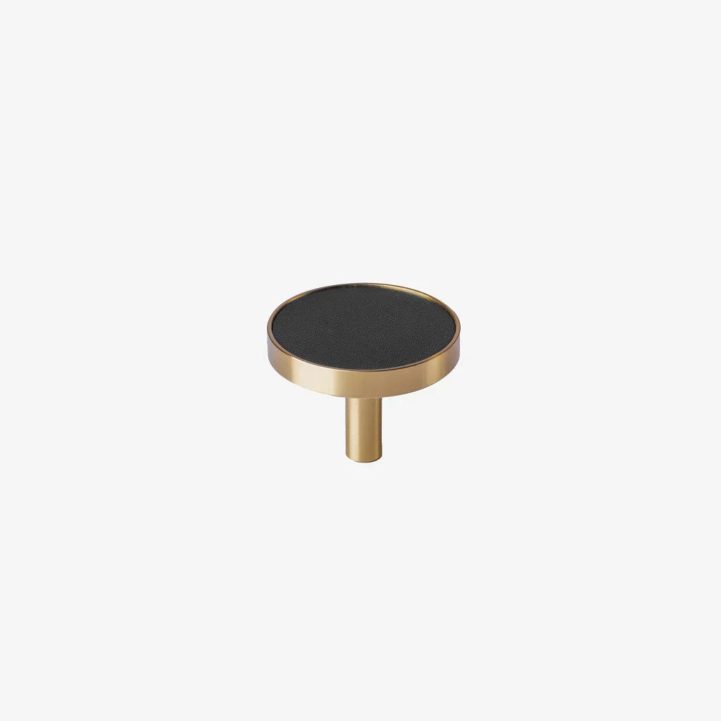 The Mantara L-0004 Obsidian Knob is a modern brass and leather knob in black, perfect for wardrobes, kitchens, and cabinets.