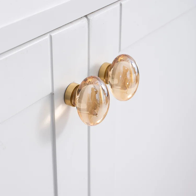The Mantara C-0008 is a modern artificial crystal + brass knob in champange/brass, ideal for wardrobes and drawers.