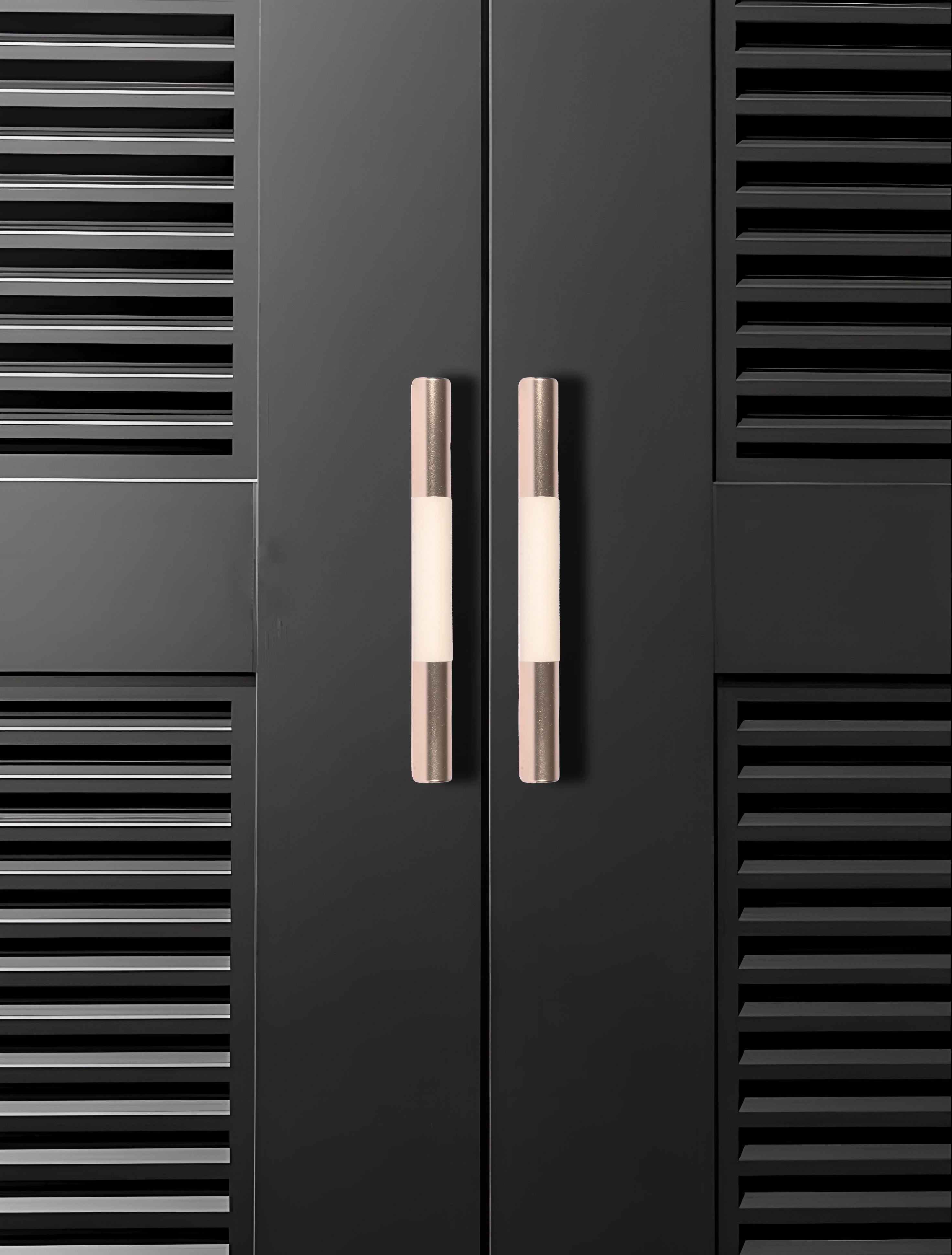 Black cabinet with sleek metallic handles set against a black background, offering a bold modern look by Mantara.