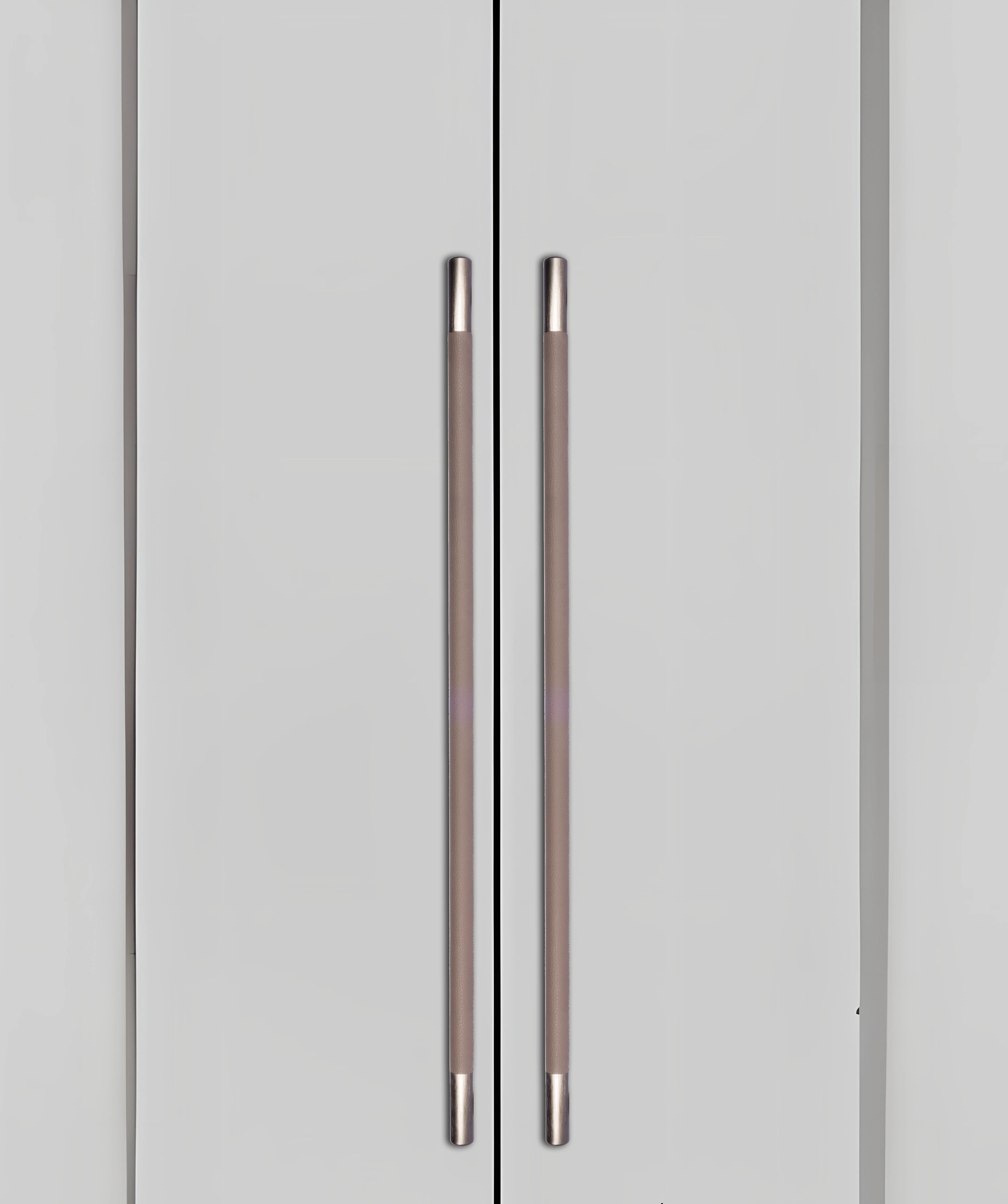 Gray cabinet doors with sleek metallic handles, blending seamlessly into a gray background, styled by Mantara.