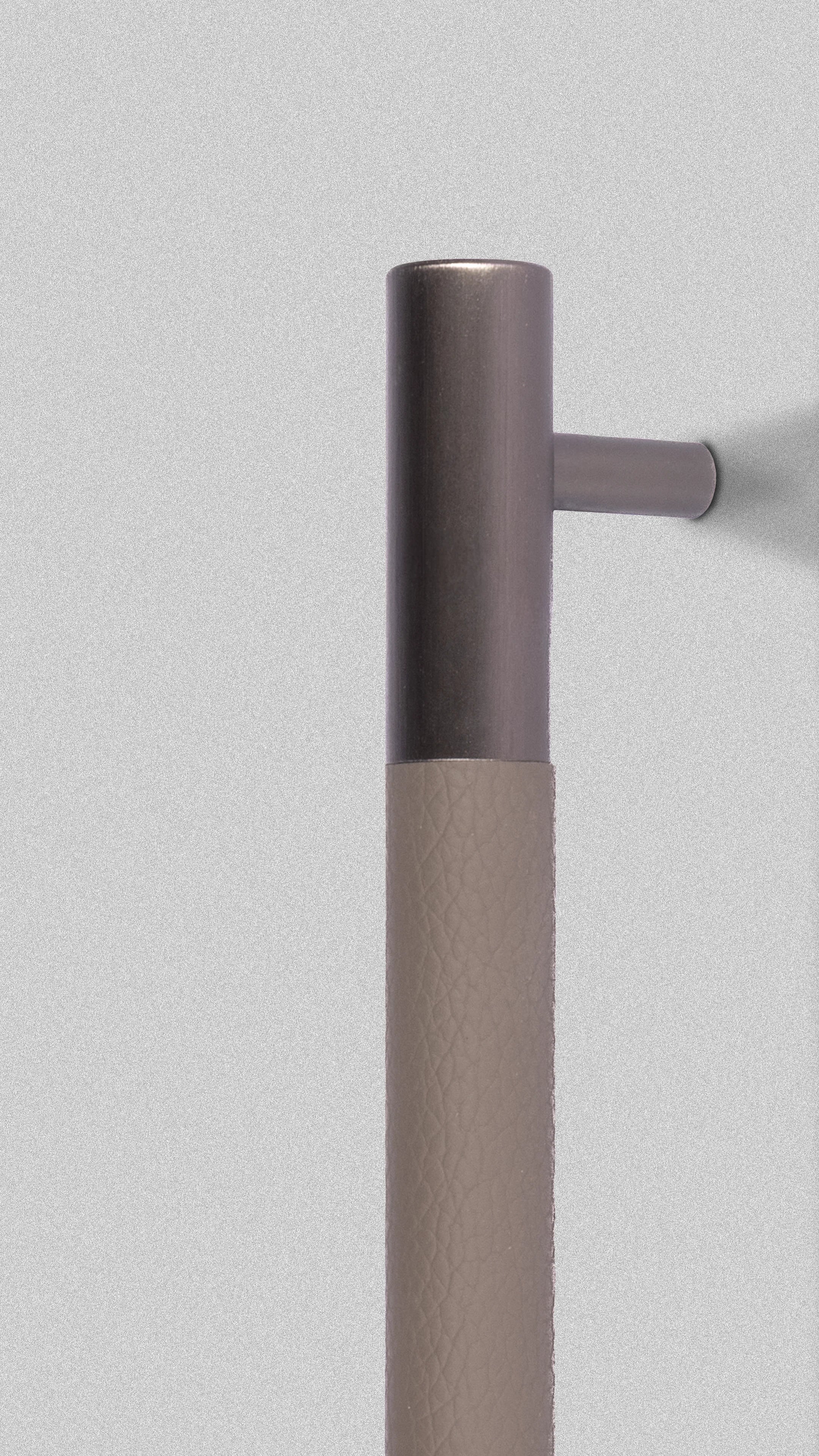 Towel bar with a metallic finish on a light gray background
