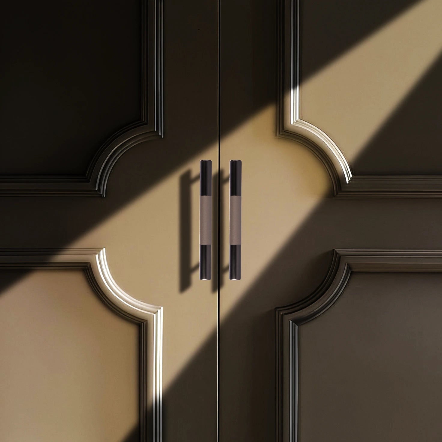 Close-up of a door with ornate decorative handles and detailed molding, highlighting classic elegance by Mantara.