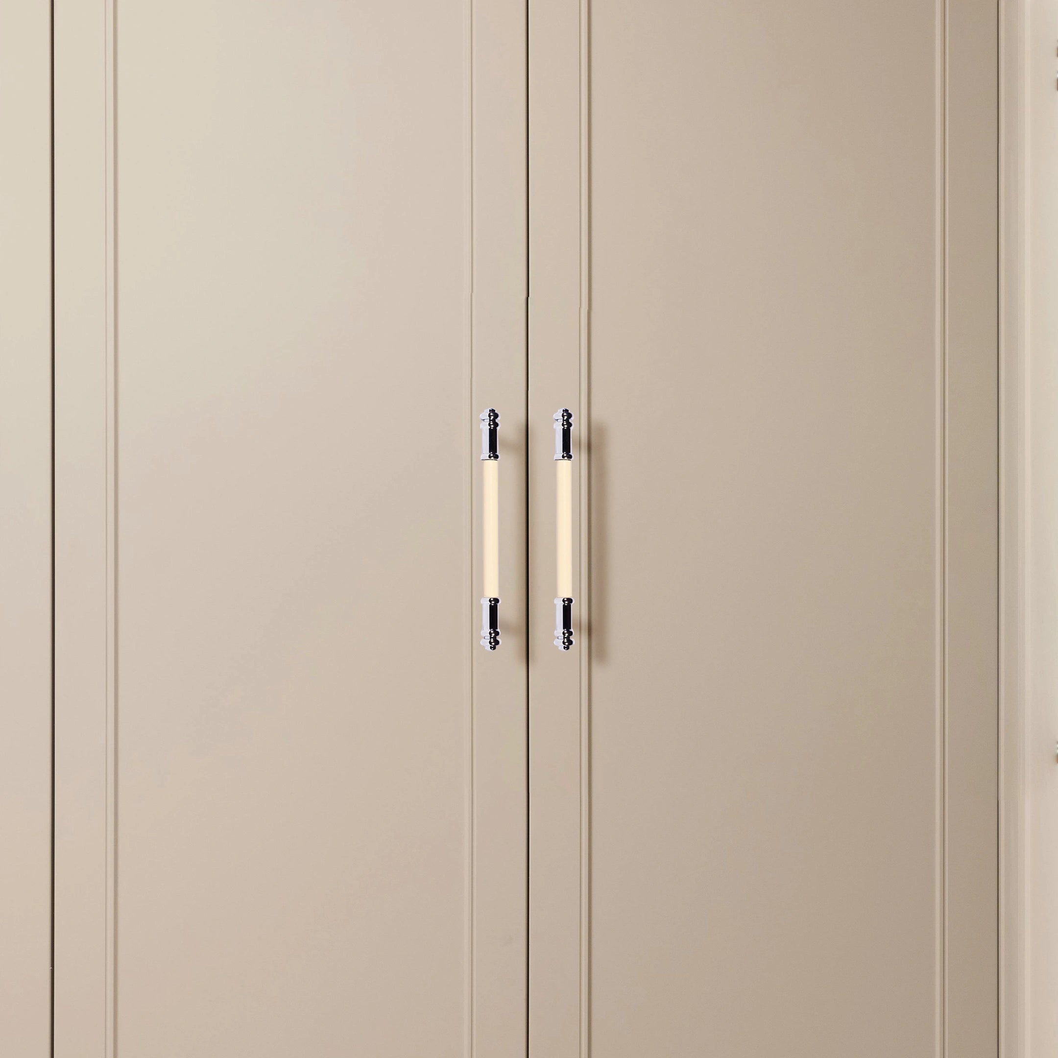 Beige wardrobe with two doors and sleek metallic handles, offering a soft, contemporary look by Mantara.
