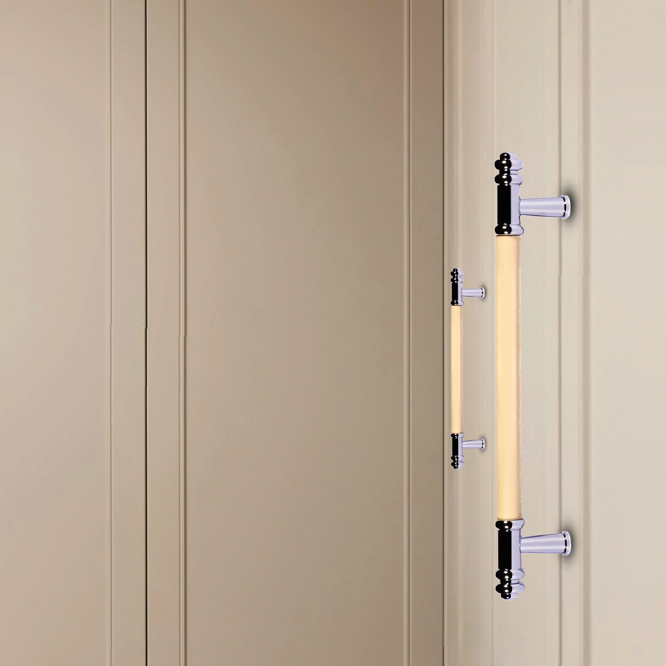 Beige cabinet with decorative handles set against a matching beige background, creating a subtle, elegant look by Mantara.
