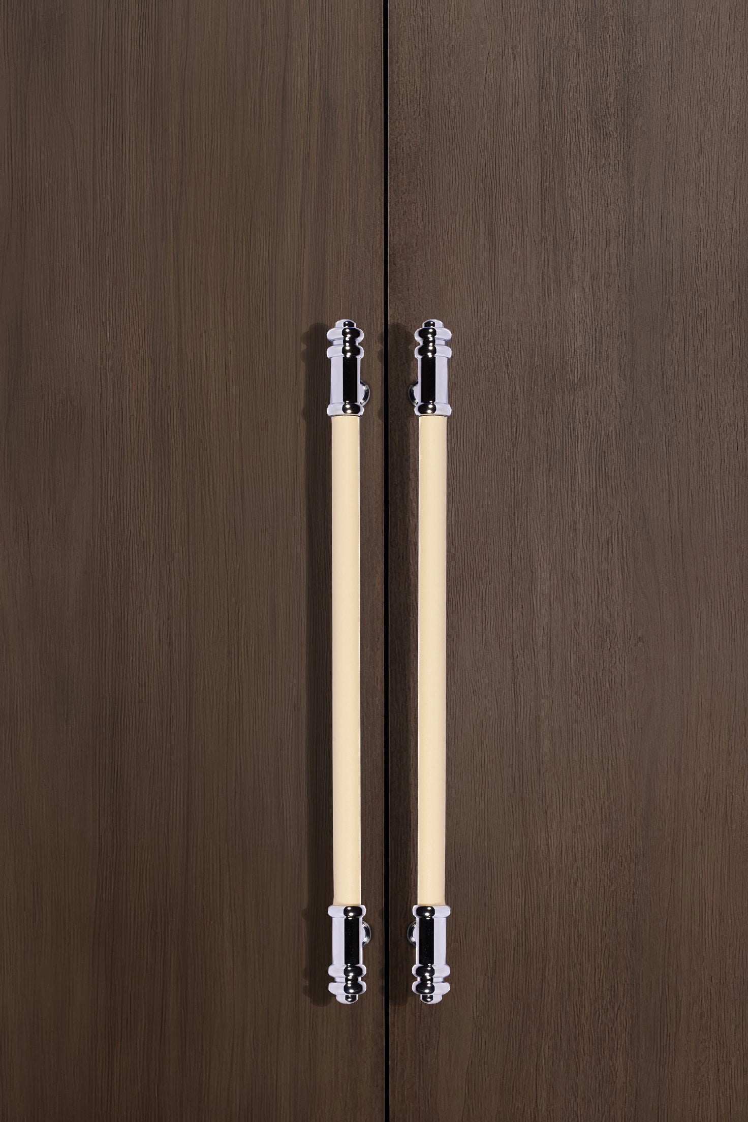 Pair of wooden pencils with metal clips placed on a wooden surface, showcasing a simple, refined design by Mantara.