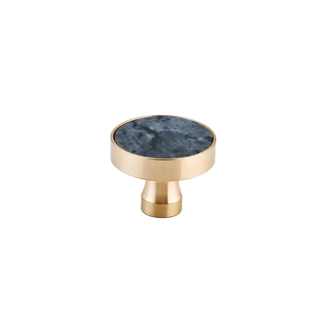 The Mantara M-0004 Carrara Knob is a modern stone and brass knob in shimmer stone, ideal for drawers and cabinets.