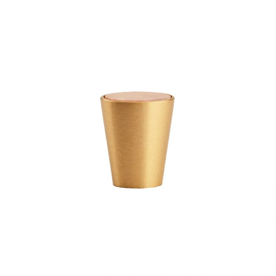Gold-colored cylindrical container with a lid on a white background