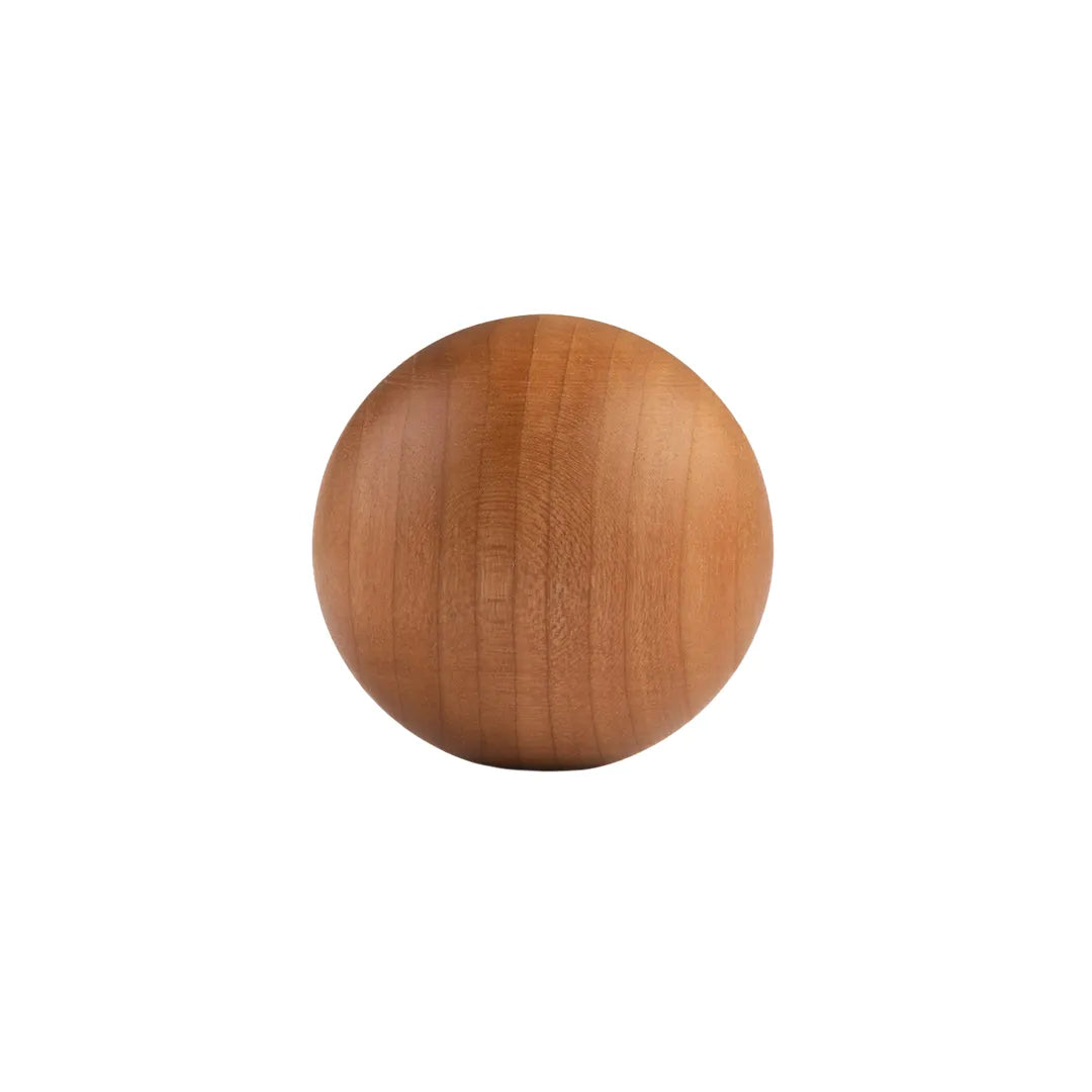 A round wooden knob with a smooth, polished finish and visible wood grain, centered on a plain white background.