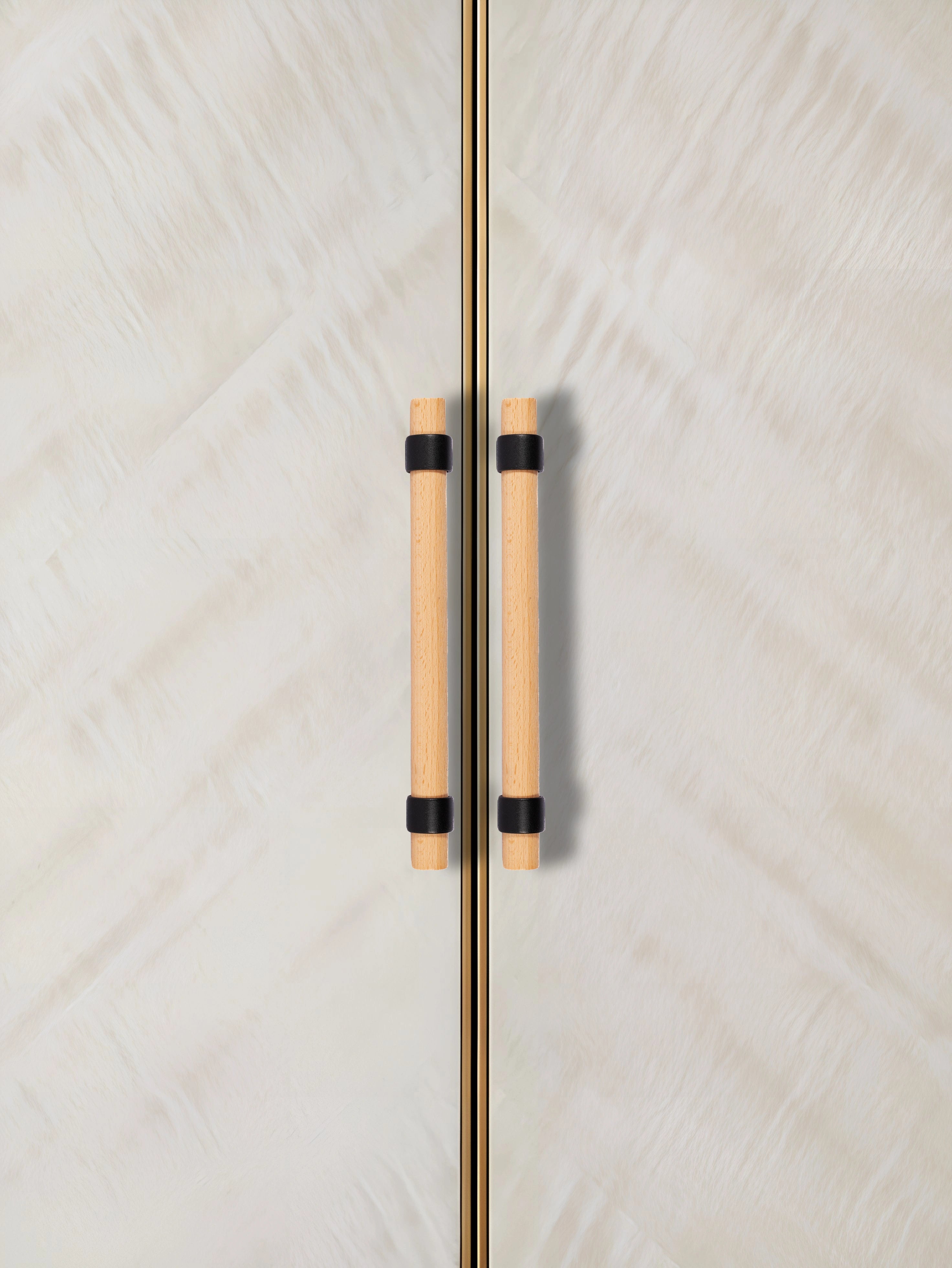 Close-up of a door with wooden handles, set against a textured white background—natural warmth meets simplicity by Mantara.