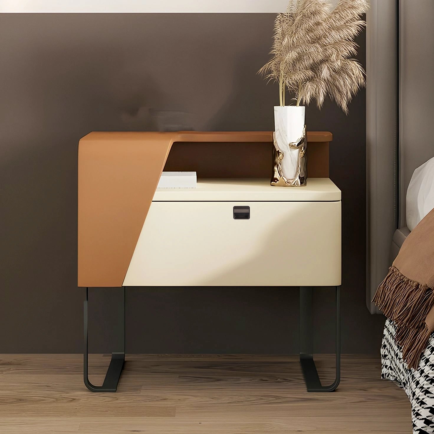 Modern nightstand with a geometric front and a subtle knob, styled in a cozy bedroom setting—designed by Mantara.