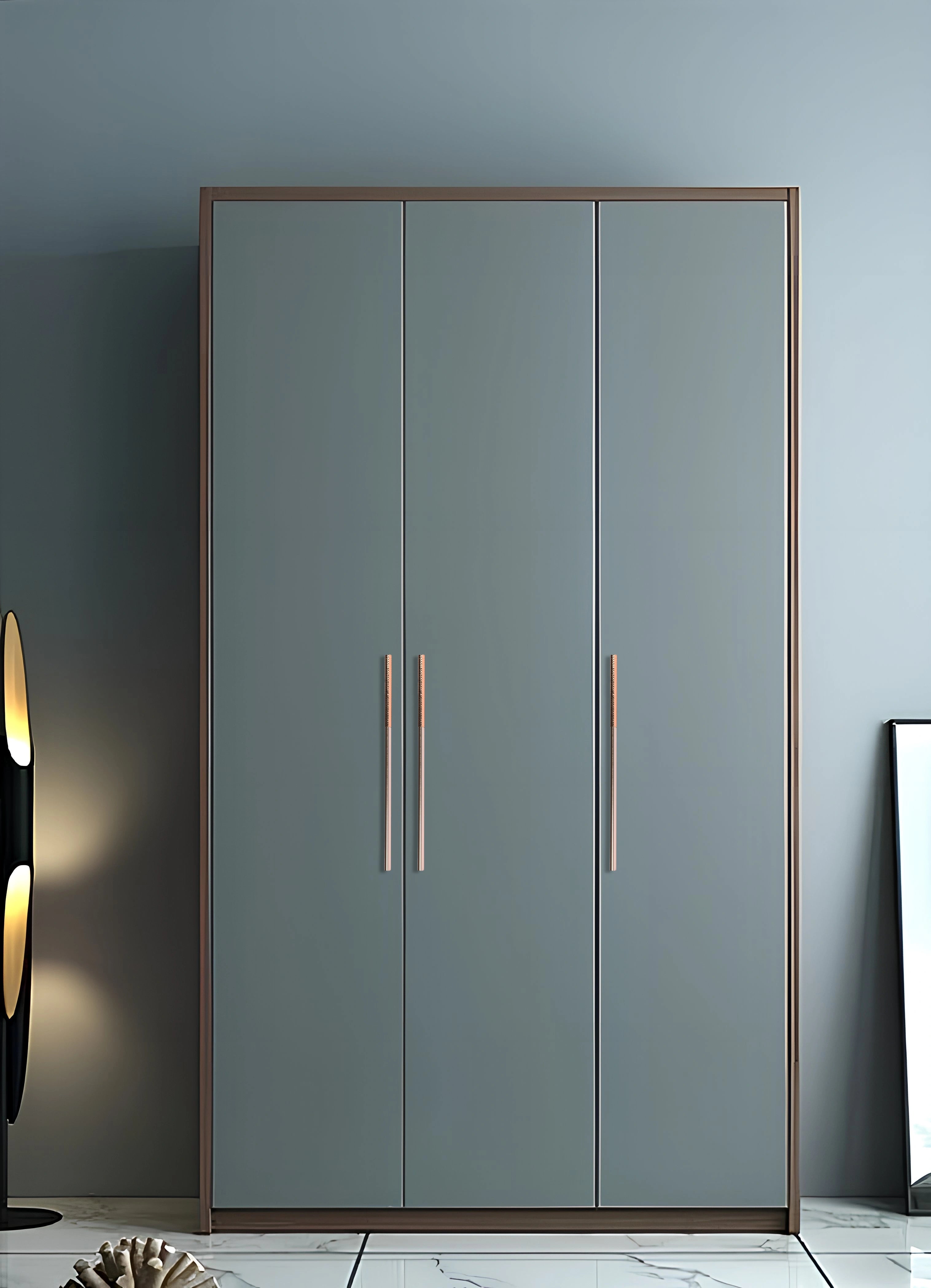 Gray wardrobe with Rosegold handles, set against a matching gray wall—tonal elegance and modern form by Mantara.