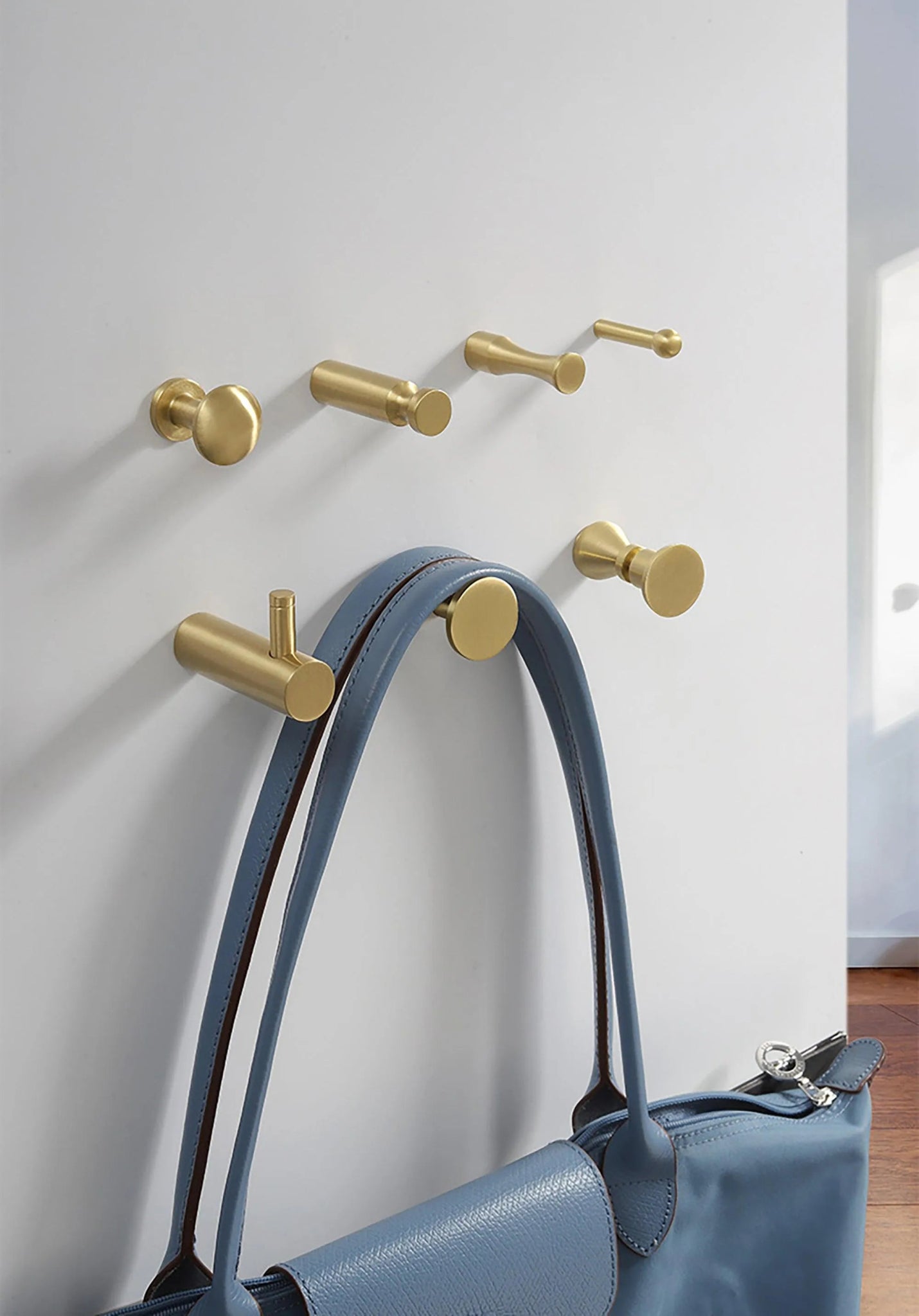 Mantara Amara Hook B-0092 is a modern brushed brass wall hook in gold, ideal for bathrooms, bedrooms, and living areas.