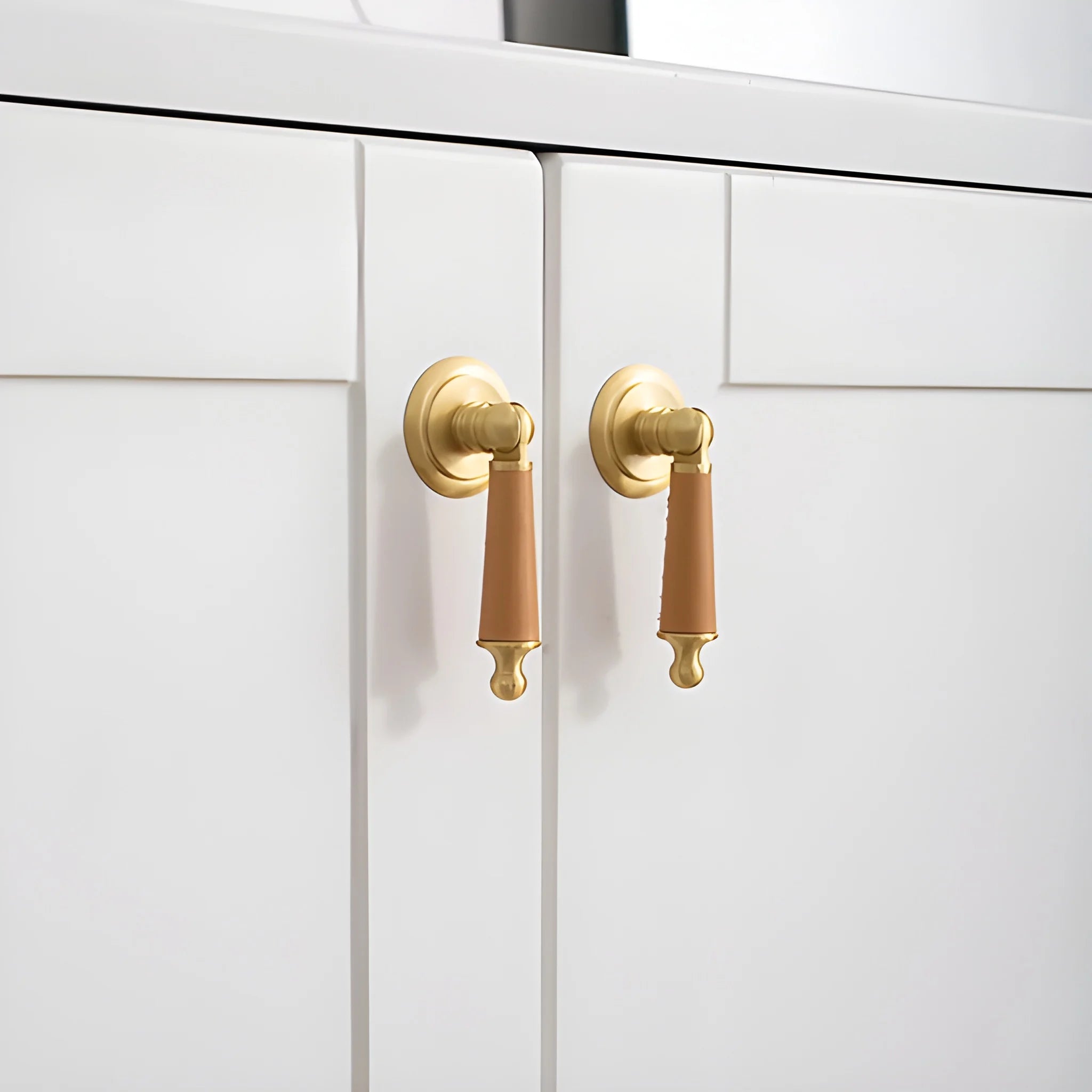 Leather and brass drop knob in brown finish by Mantara, model Austere Drop Knob with L-0009.