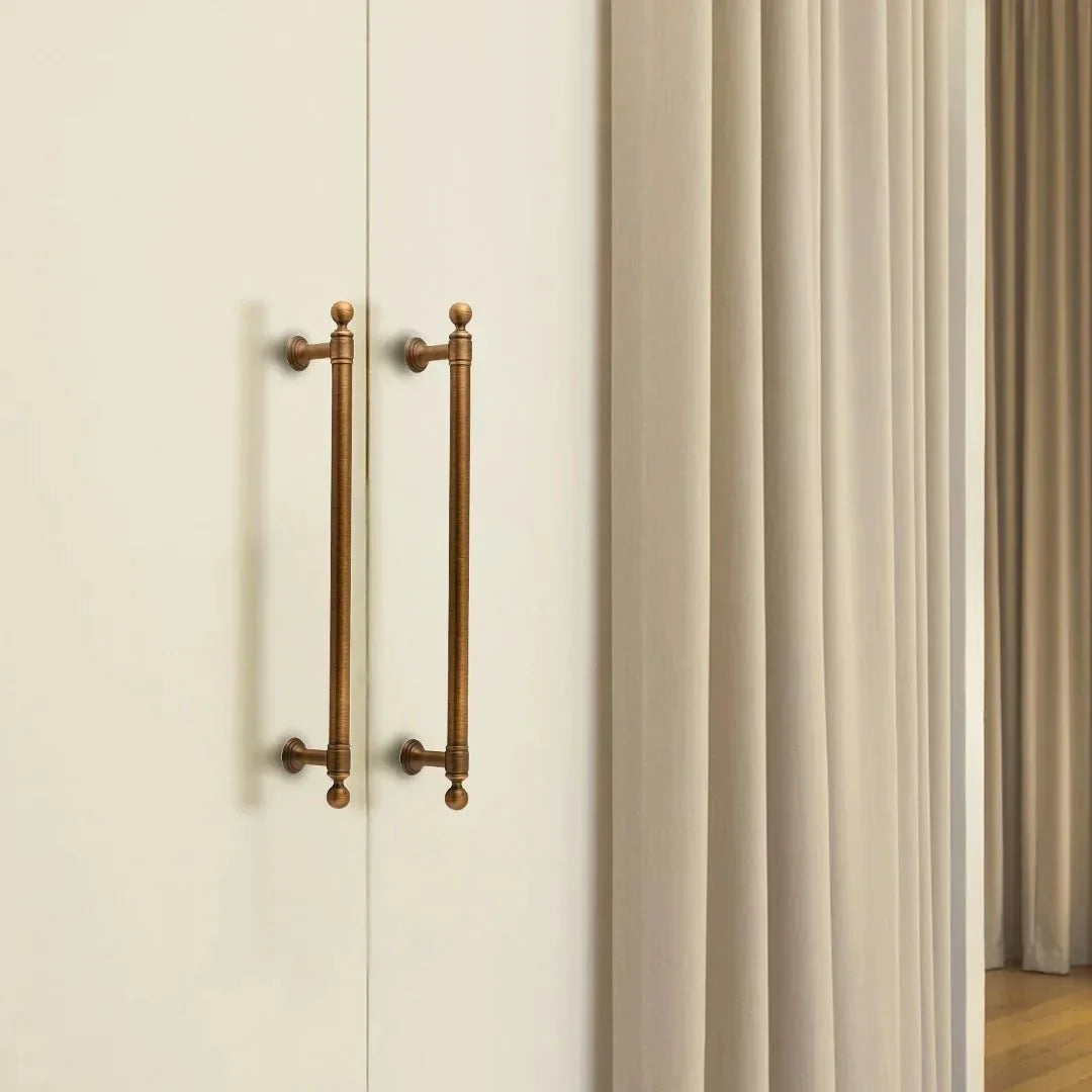 The Mantara B-0127 Caelum Handle is a modern brass handle in bronze and gold, perfect for kitchen drawers, cabinets, and furniture.