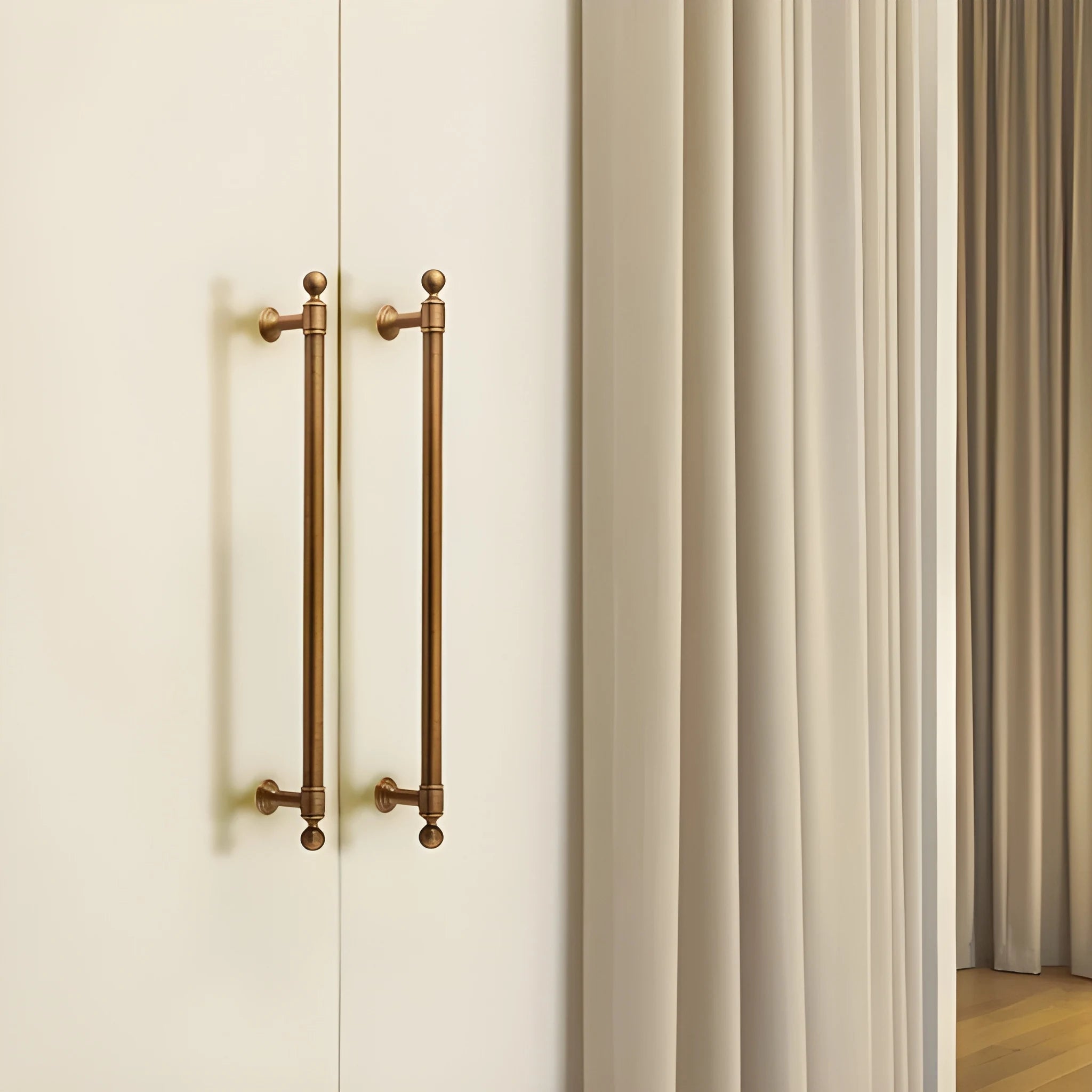 The Mantara B-0127 Caelum Handle is a modern brass handle in bronze and gold, perfect for kitchen drawers, cabinets, and furniture.