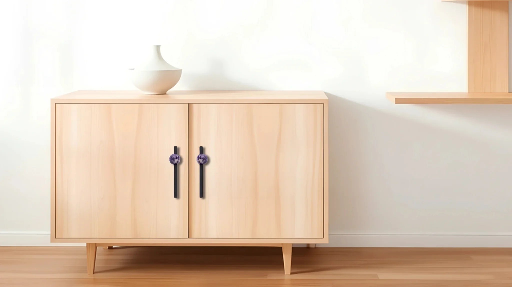 The Mantara C-0027 Calyx Handle is a modern crystal handle in black+purple, ideal for cabinets, wardrobes, and drawers.