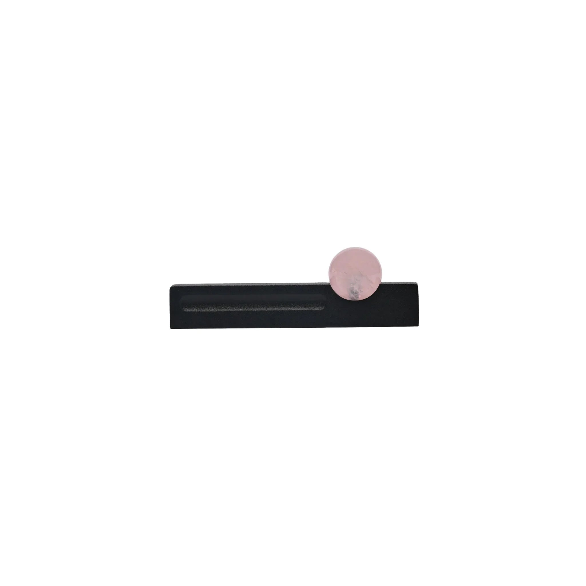 The Mantara C-0027 Calyx Handle is a modern crystal handle in black and pink, ideal for cabinets, wardrobes, and drawers.