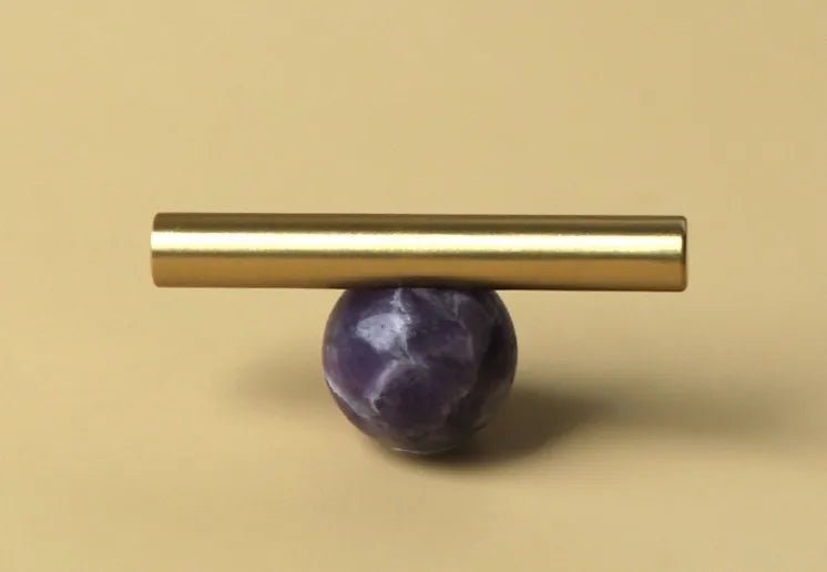 The Mantara C-0020 Chroma T-Bar is a modern crystal and brass knob in purple, ideal for drawers and cabinets.