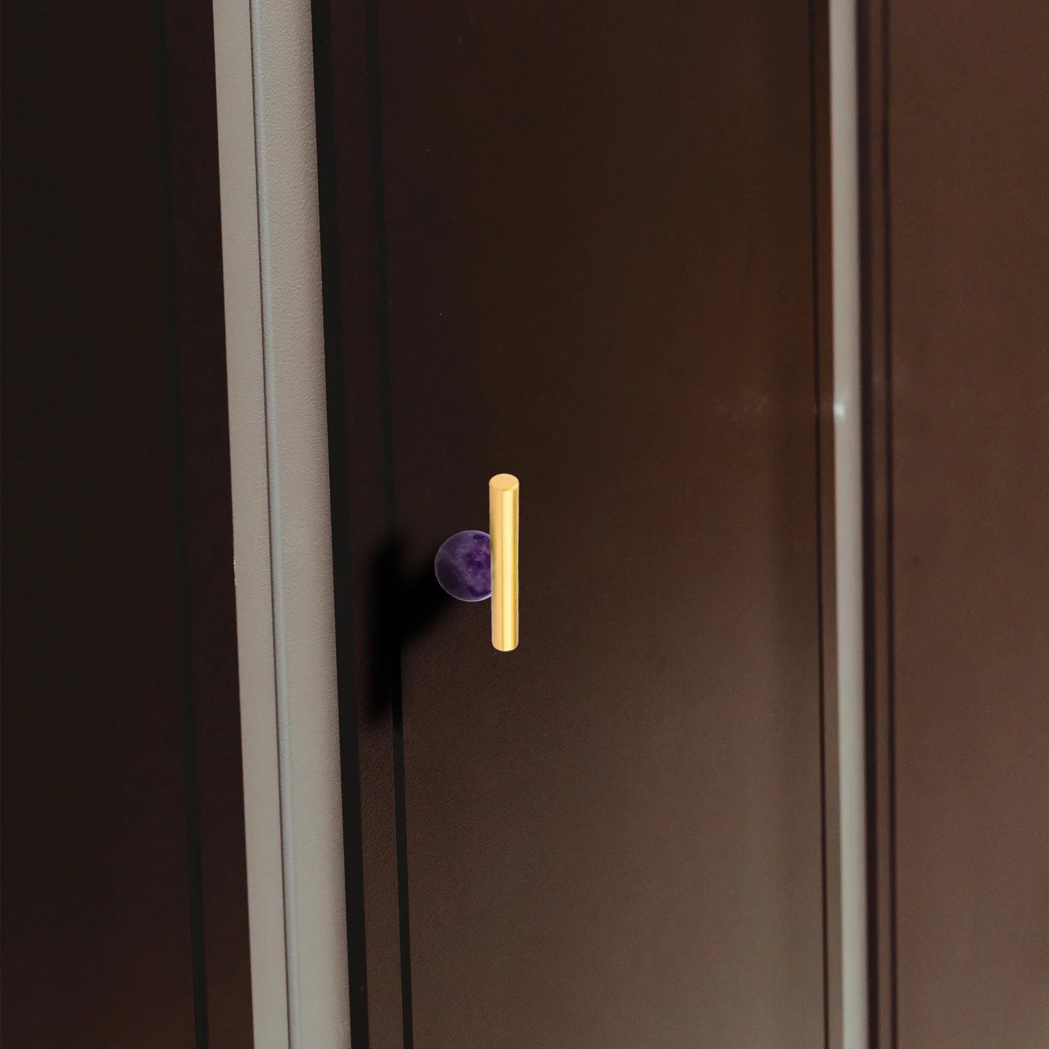 The Mantara C-0020 Chroma T-Bar is a modern crystal and brass knob in purple, ideal for drawers and cabinets.