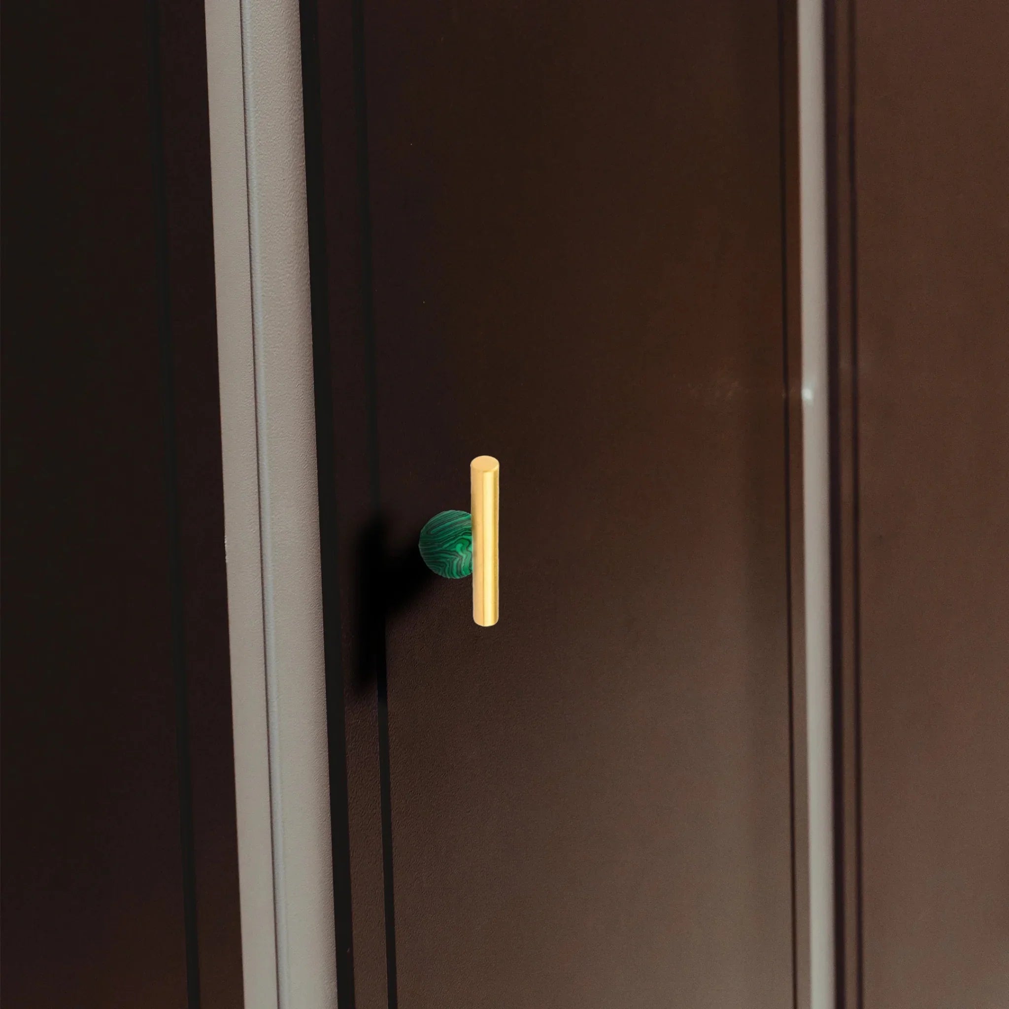 The Mantara C-0020 Chroma T-Bar is a modern crystal and brass knob in green, ideal for drawers and cabinets.