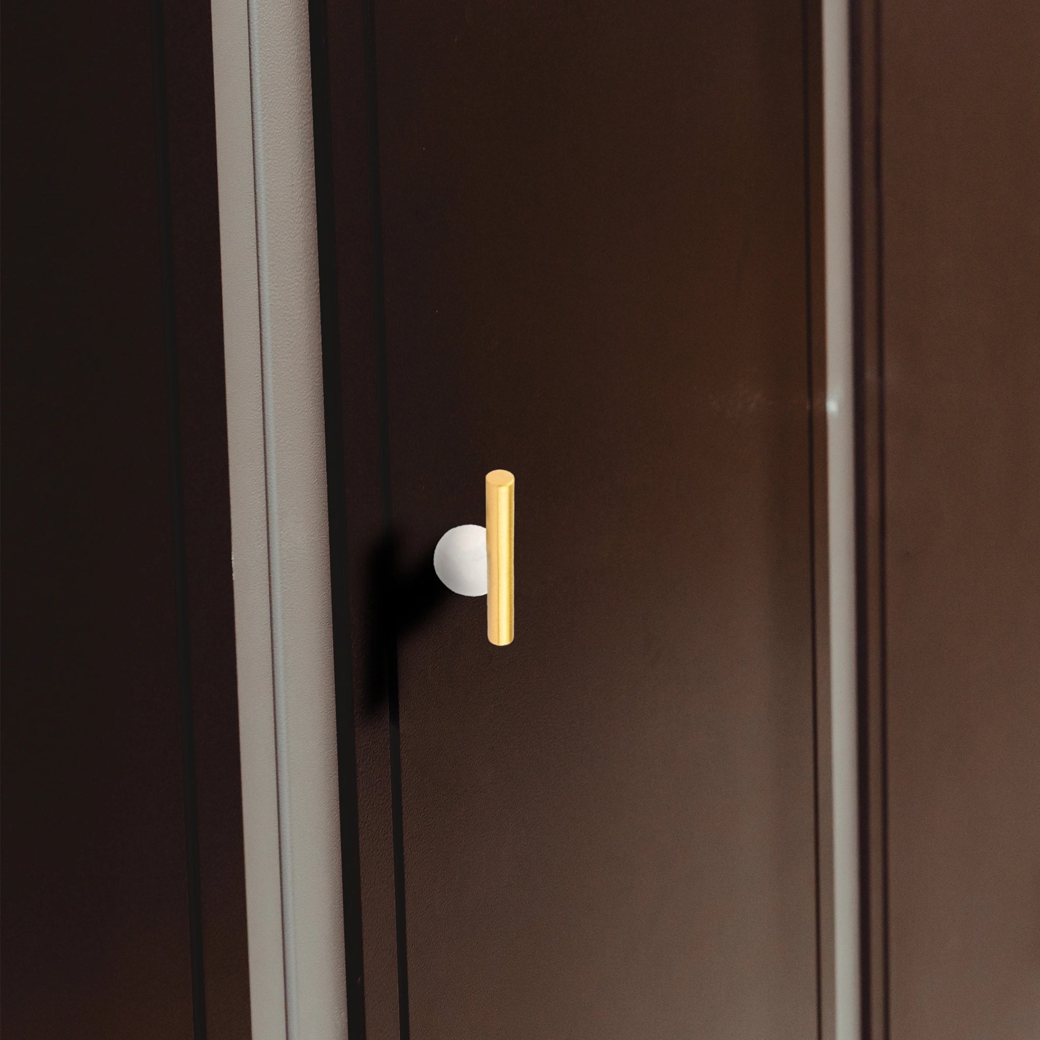 The Mantara C-0020 Chroma T-Bar is a modern crystal and brass knob in white, ideal for drawers and cabinets.