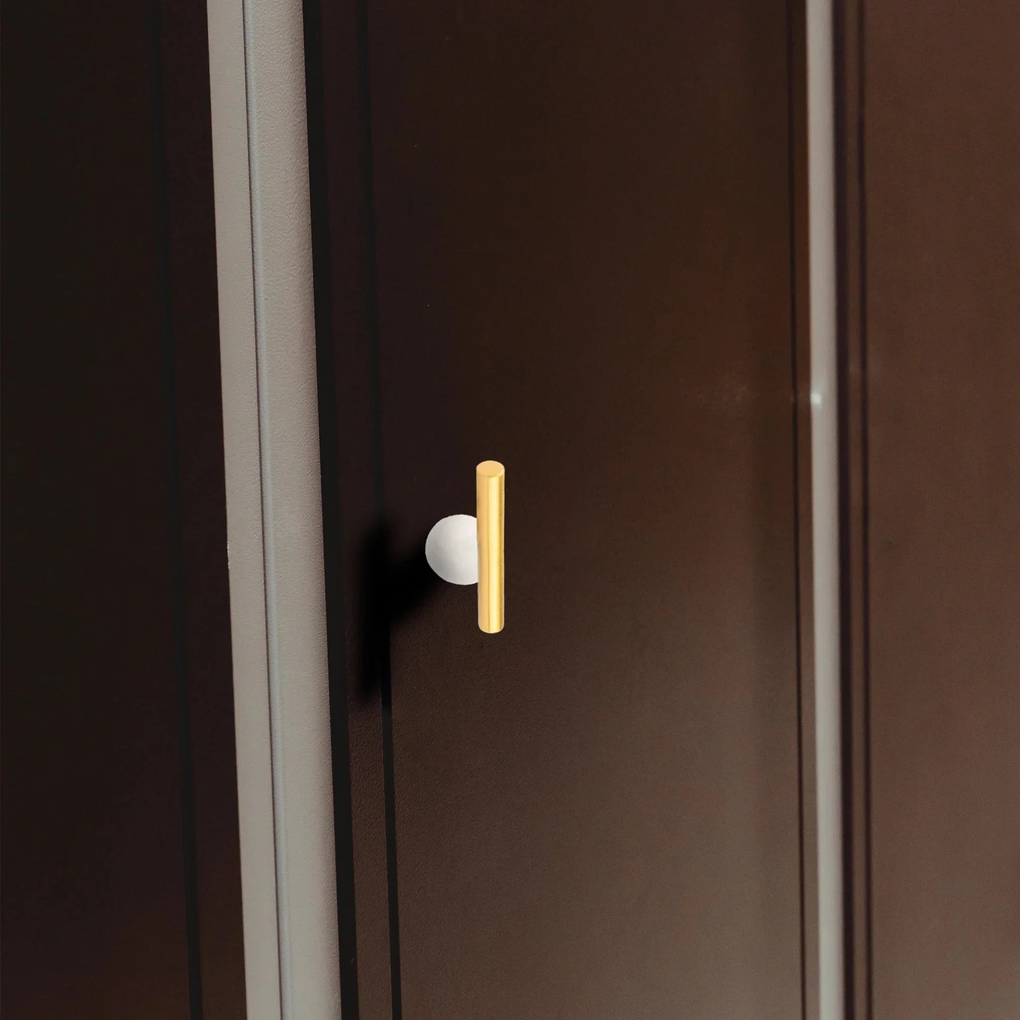 The Mantara C-0020 Chroma T-Bar is a modern crystal and brass knob in white, ideal for drawers and cabinets.