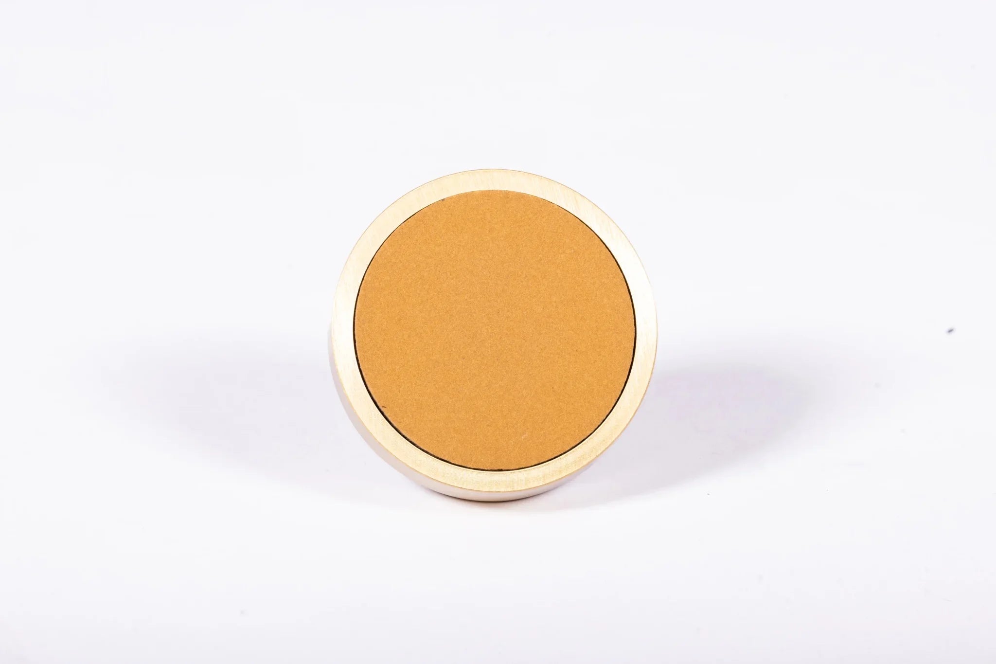 The Mantara L-0014 is a modern leather + brass knob in orange, perfect for kitchen drawers and dressers.
