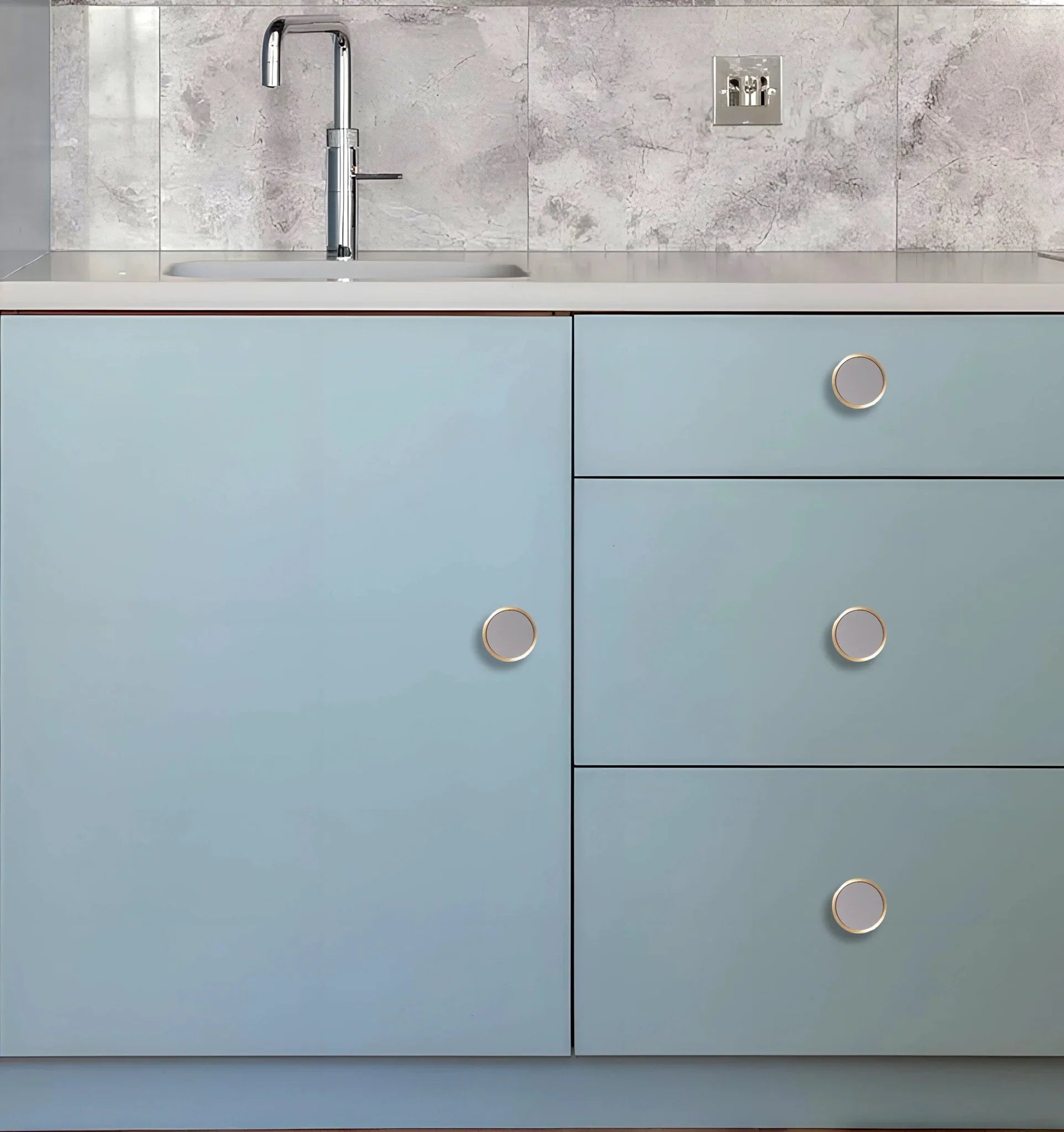 The Mantara L-0014 is a modern leather + brass knob in grey, perfect for kitchen drawers and dressers.