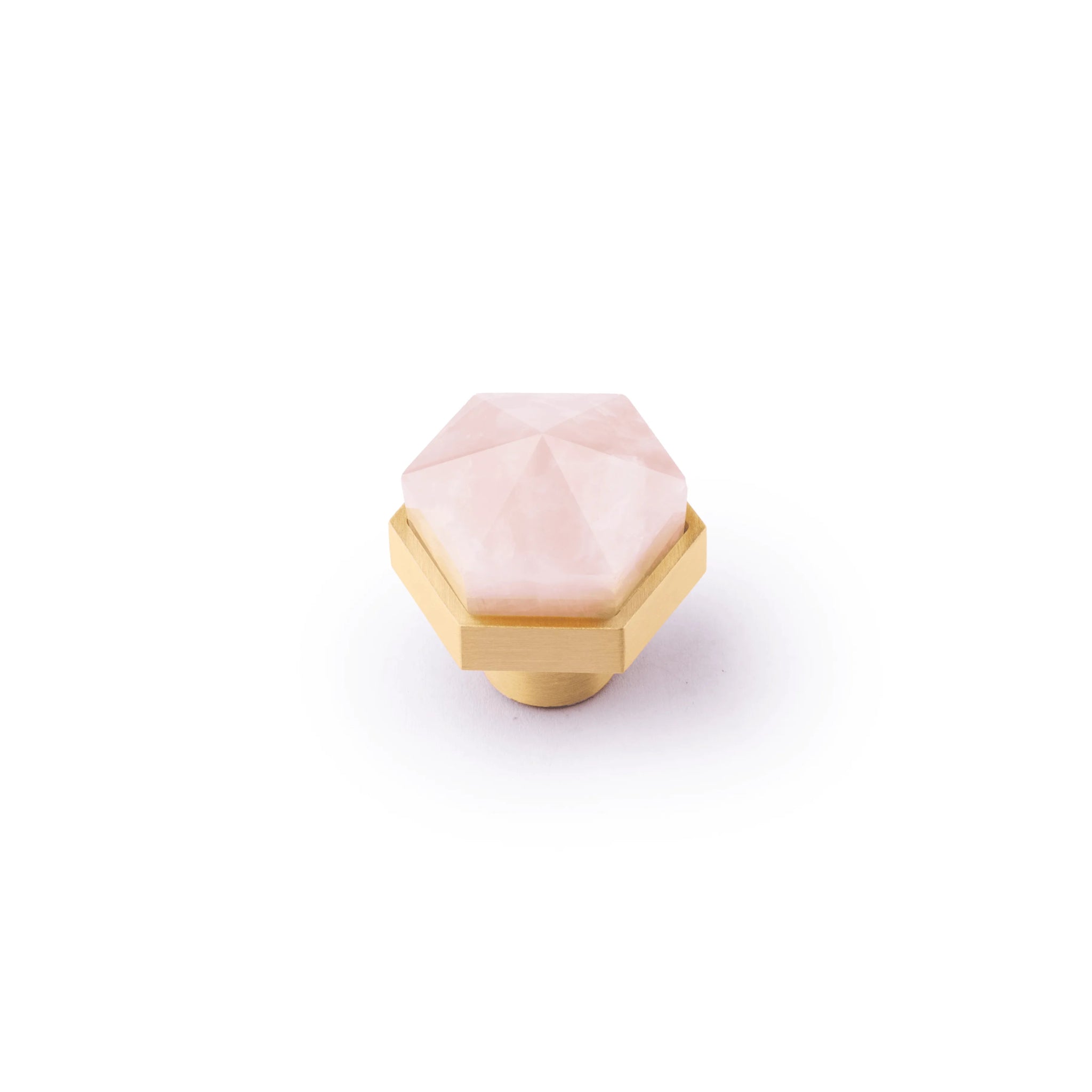 The Mantara C-0005 is a modern crystal + brass knob in pink, ideal for cabinets and wardrobes.